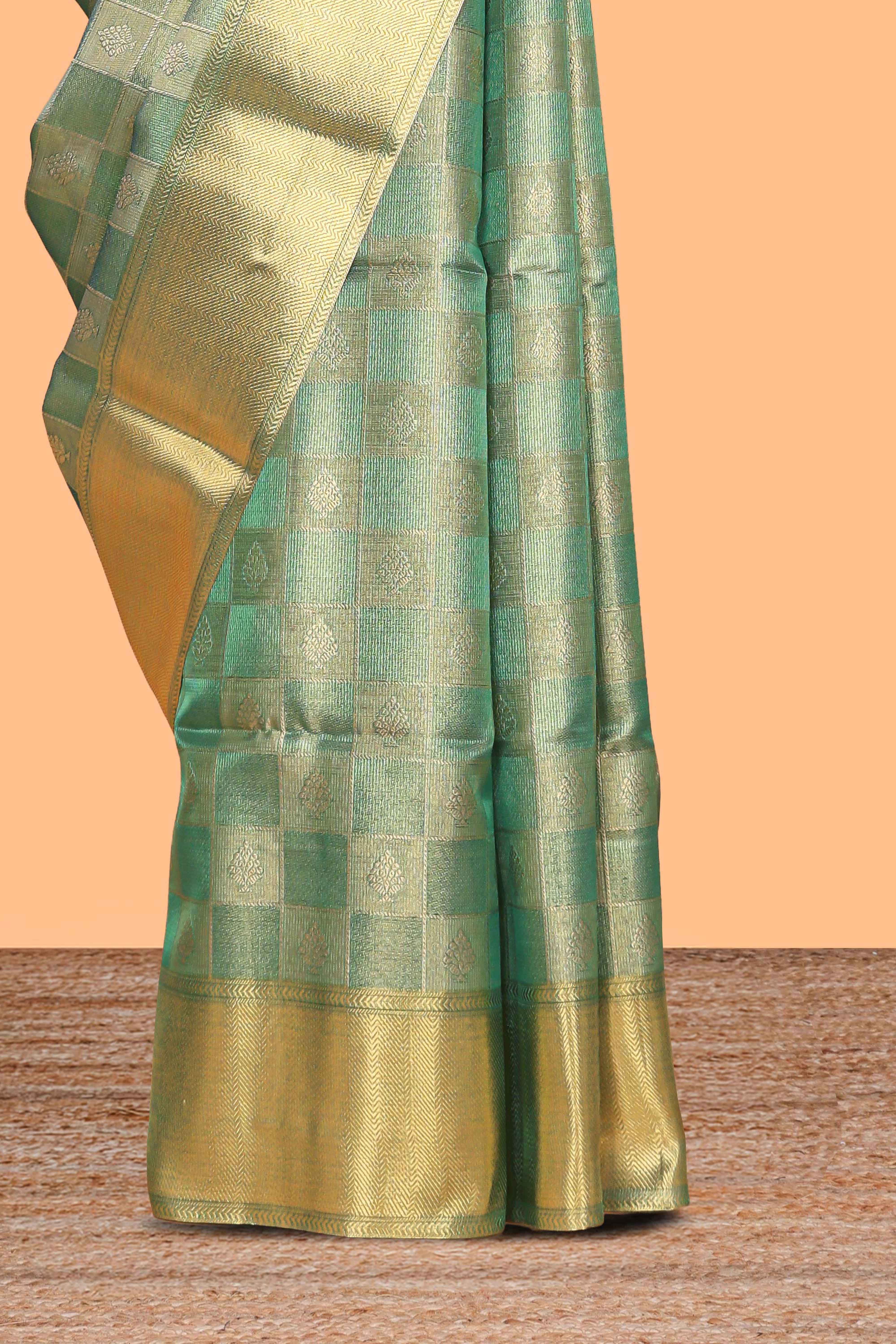 Green checked zari motifs art tissue saree with self zari border and matching blouse