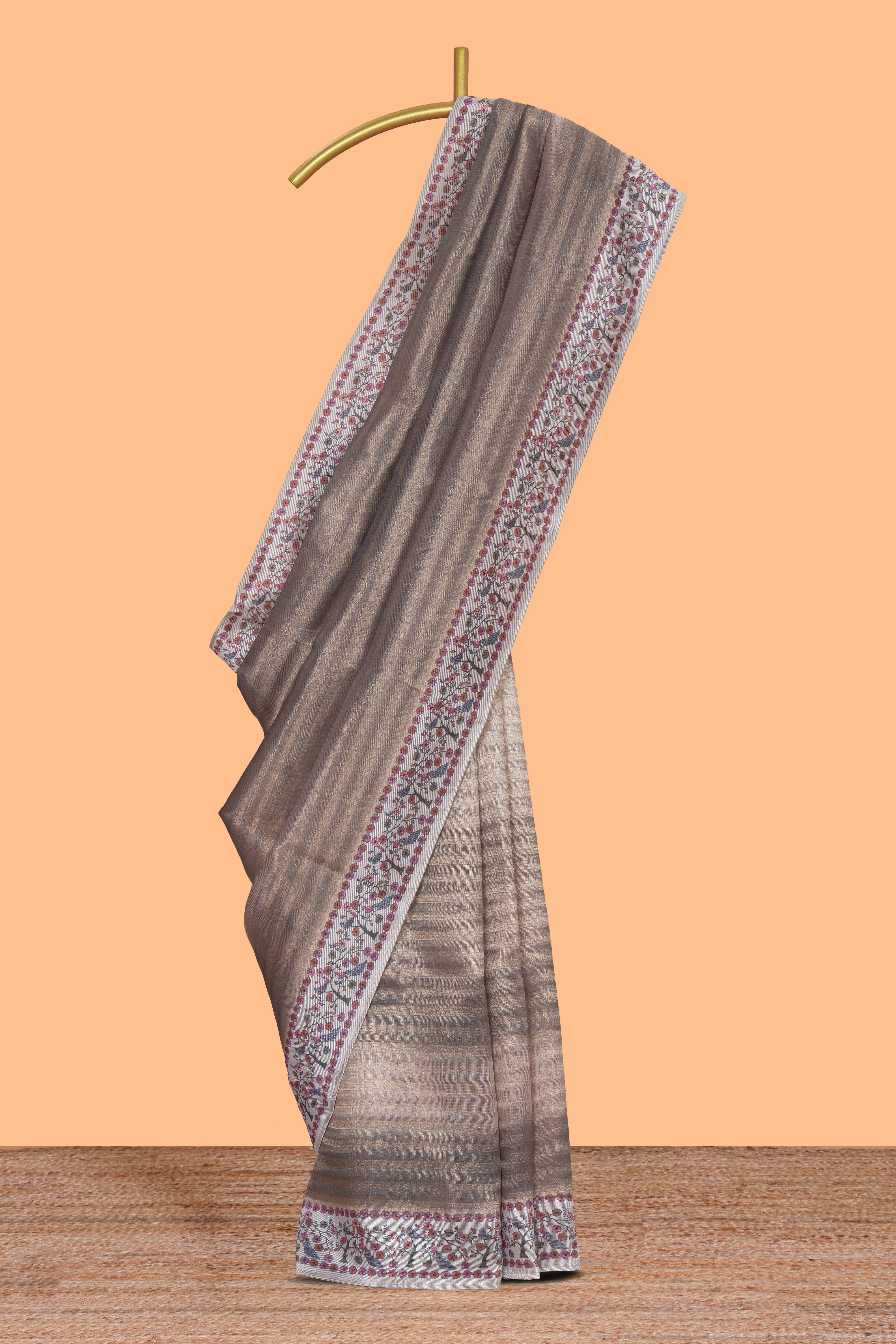 Grey striped art tissue saree with contrast floral & peacock design border and matching blouse