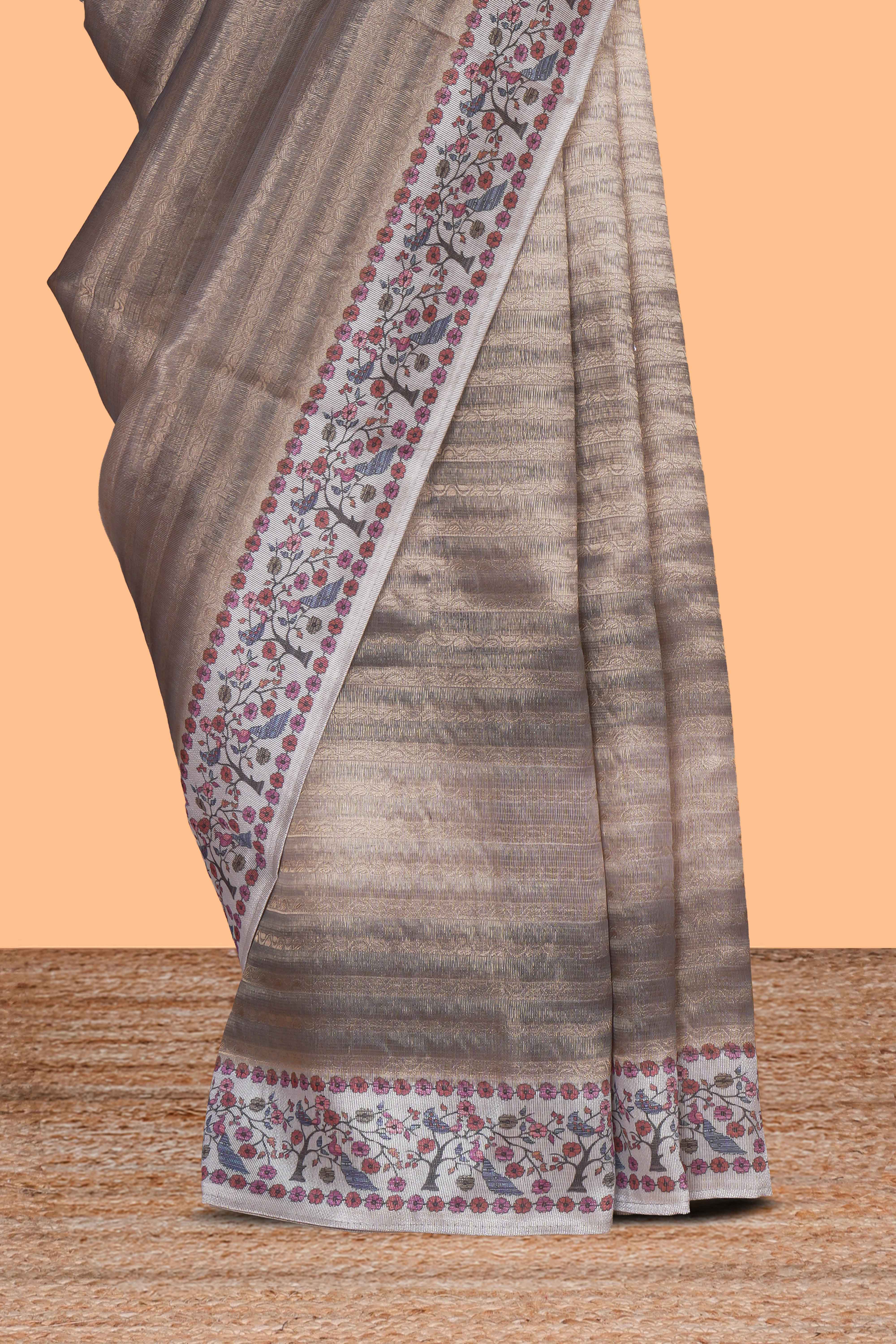 Grey striped art tissue saree with contrast floral & peacock design border and matching blouse
