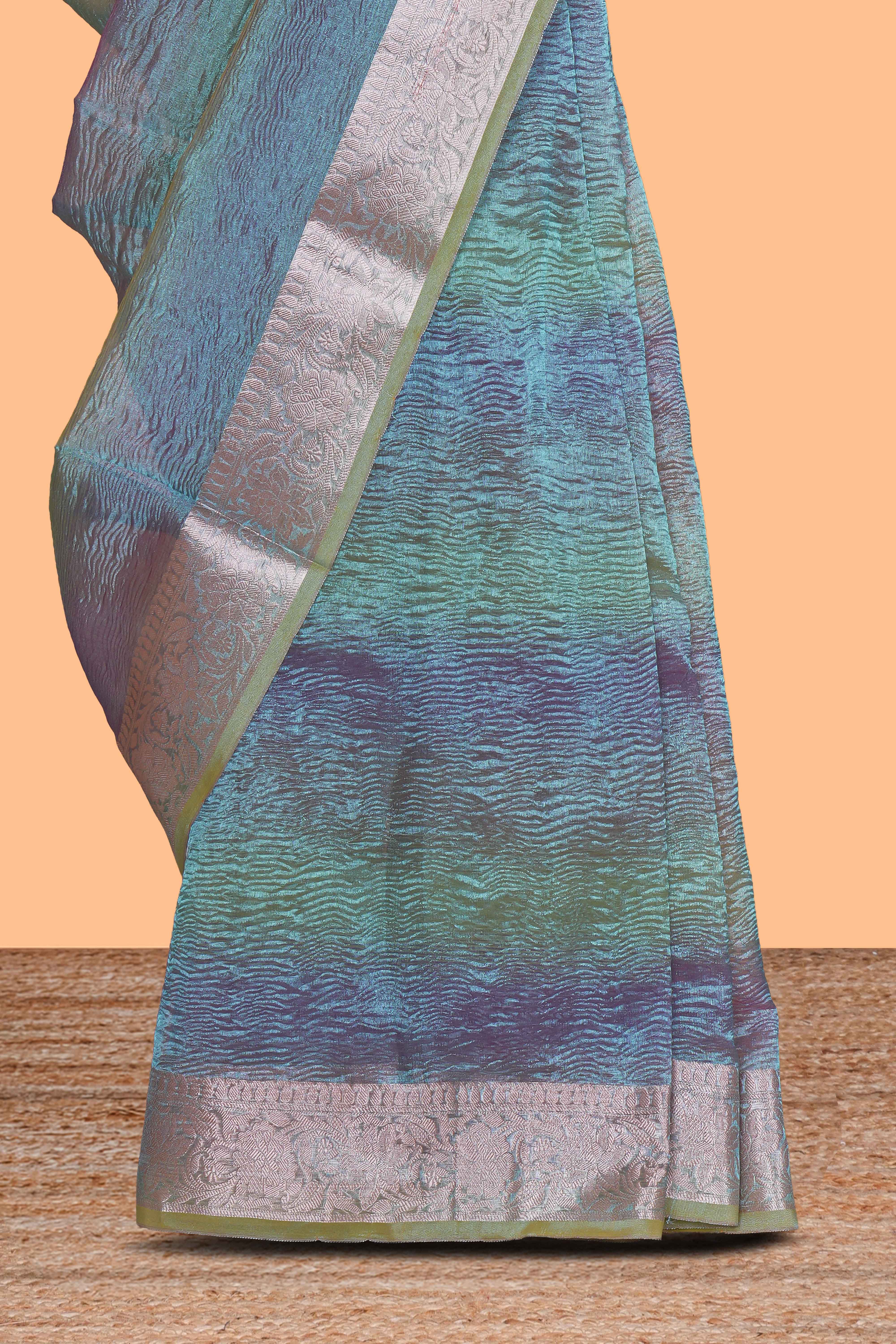 Blue crush art tissue saree with self design border and contrast zari blouse