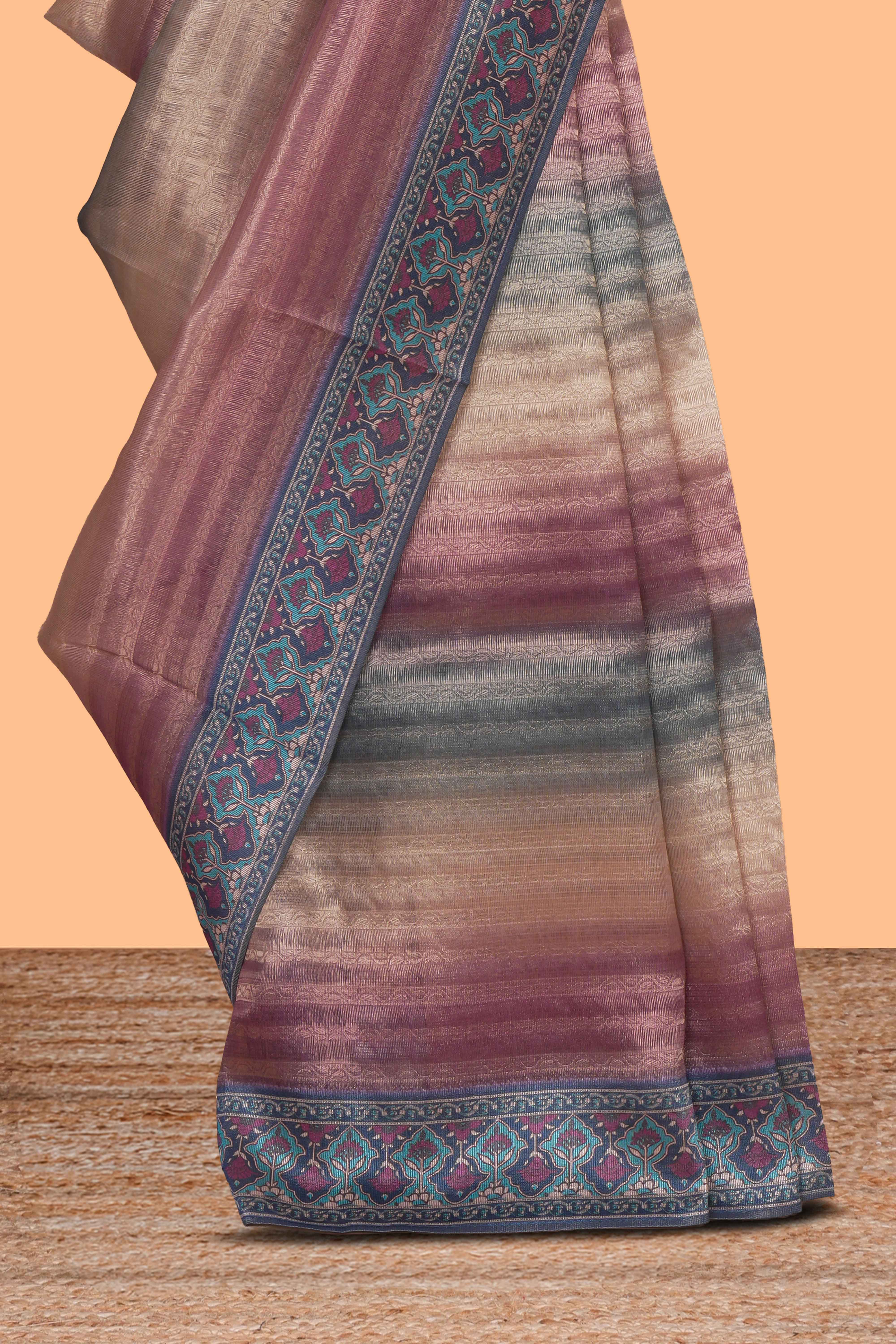 Multi color striped art tissue saree with contrast border and plain blouse