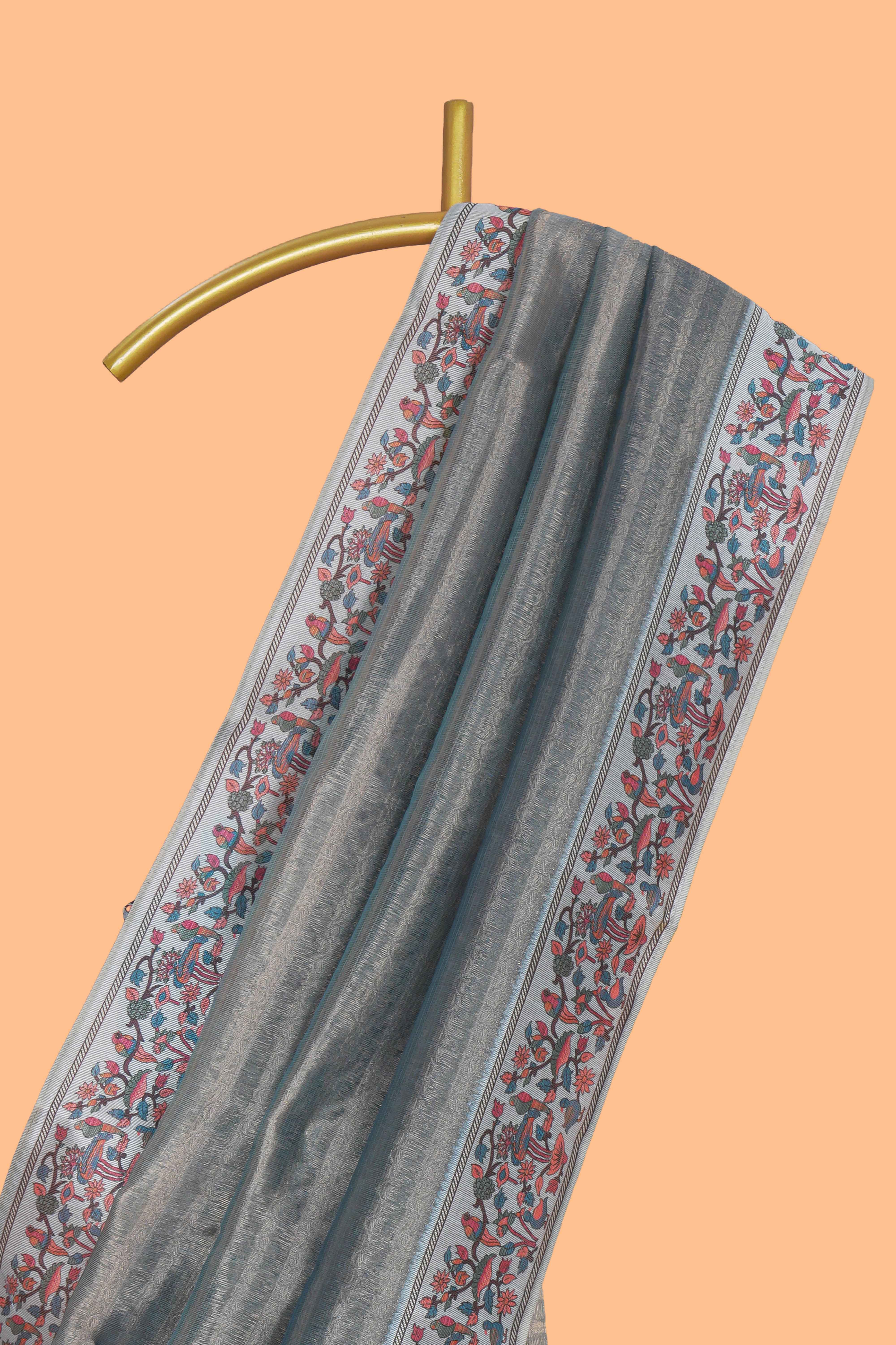 Multi color striped art tissue saree with contrast border and plain blouse