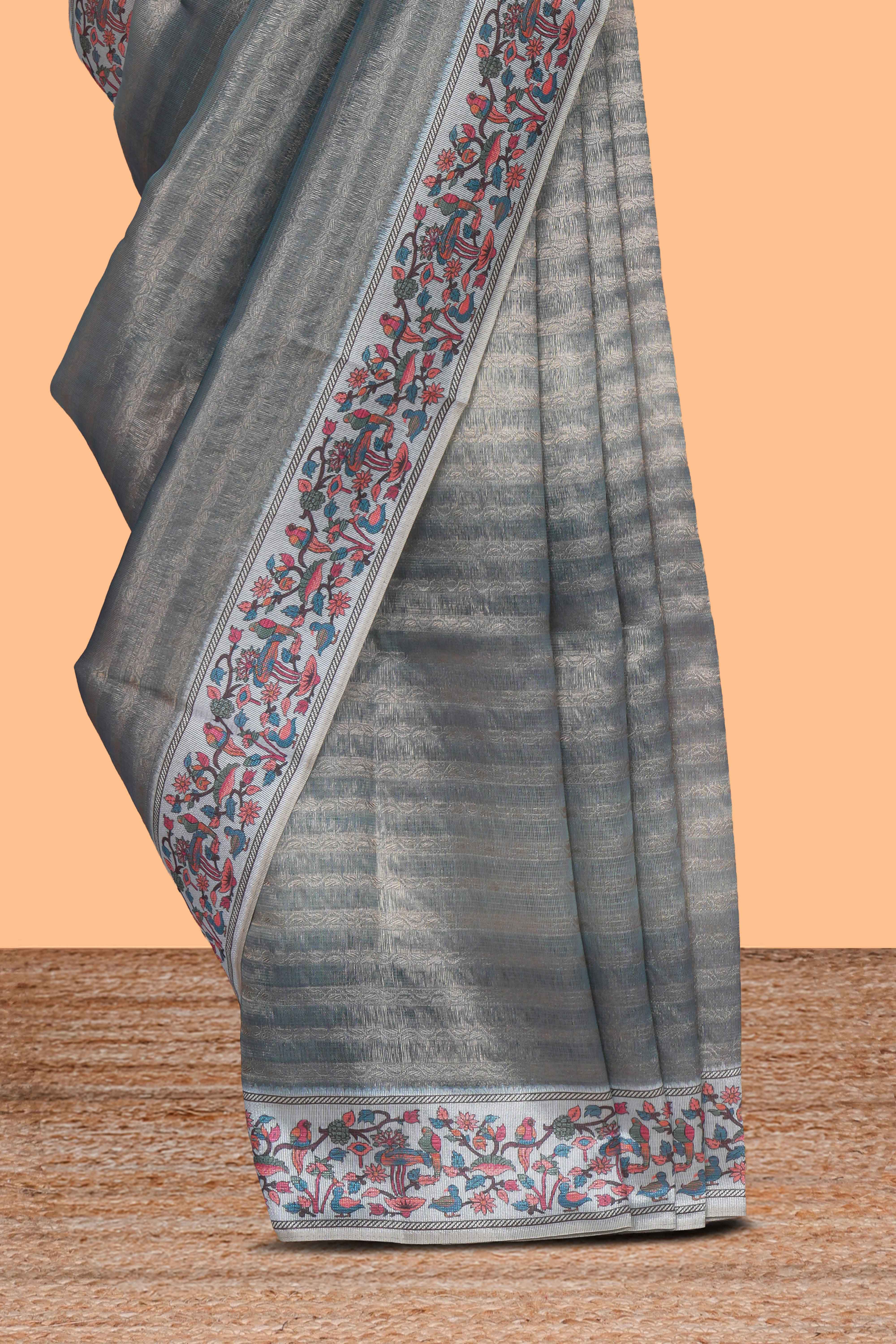 Multi color striped art tissue saree with contrast border and plain blouse