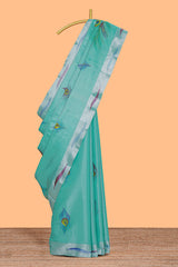 Teal green peacock feather design tissue saree with self zari border and contrast blouse