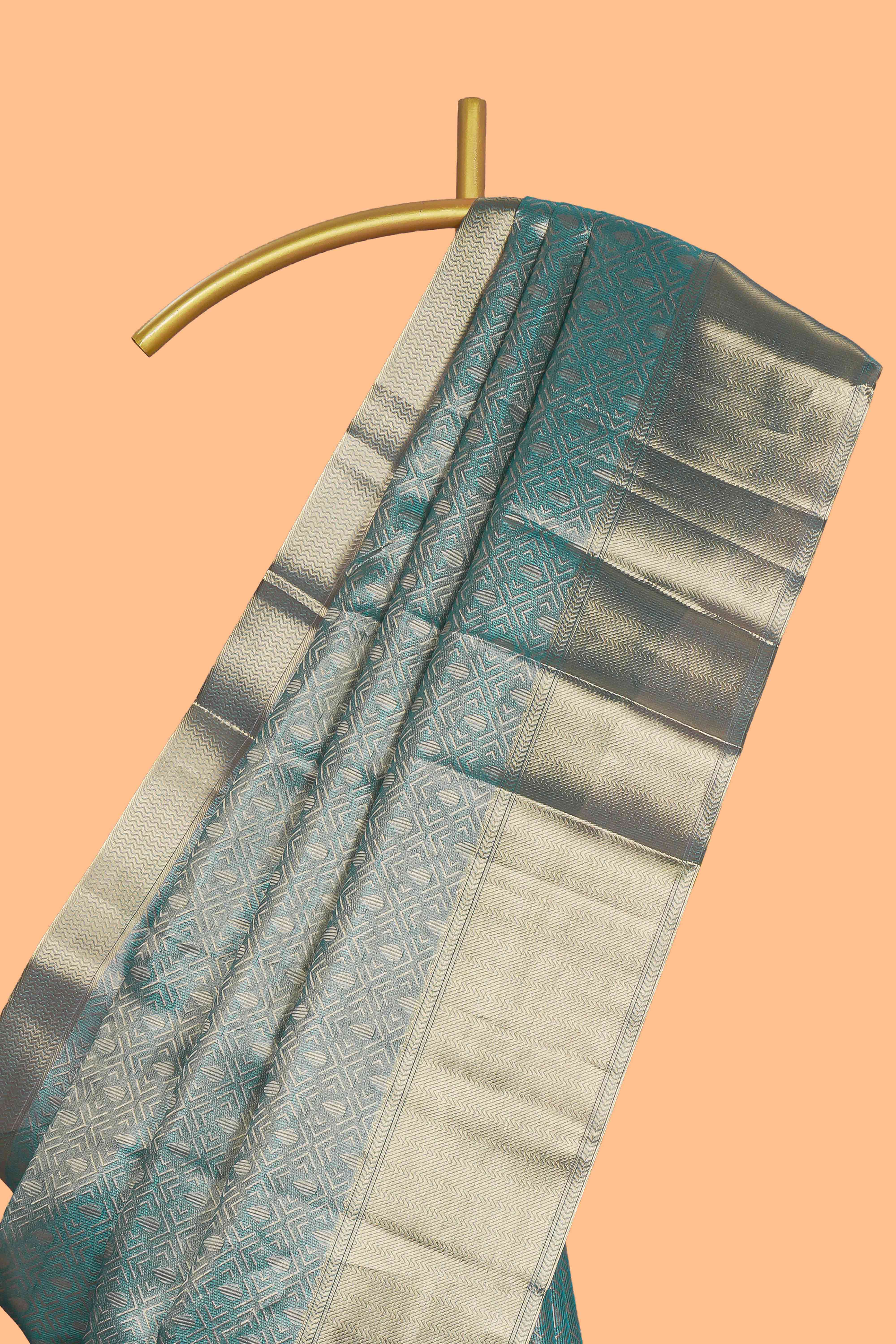 Teal blue geometric zari design art tissue saree with self zari border and matching blouse