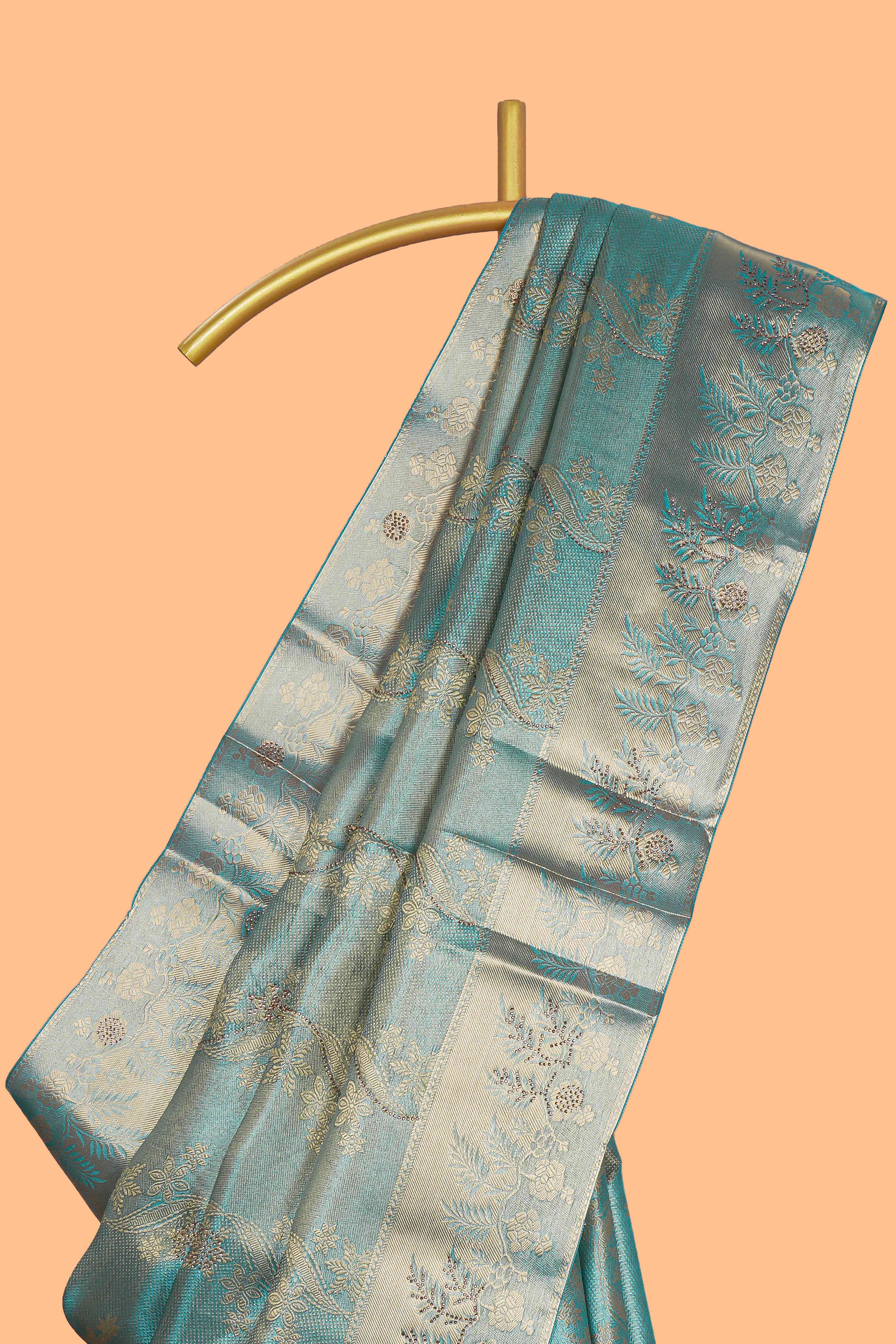 Teal blue floral vine zari design art tissue saree with self zari border and contrast blouse