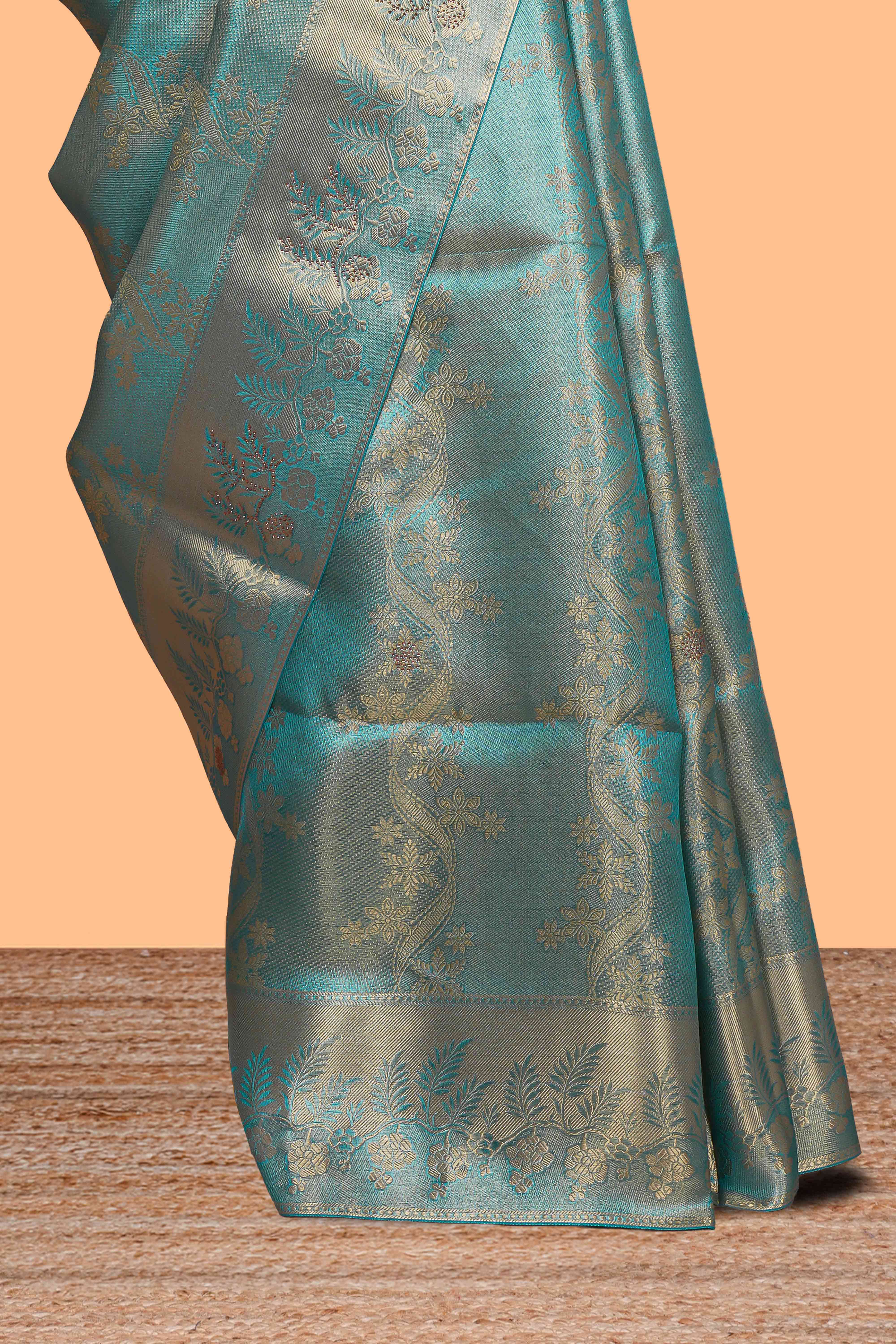 Teal blue floral vine zari design art tissue saree with self zari border and contrast blouse