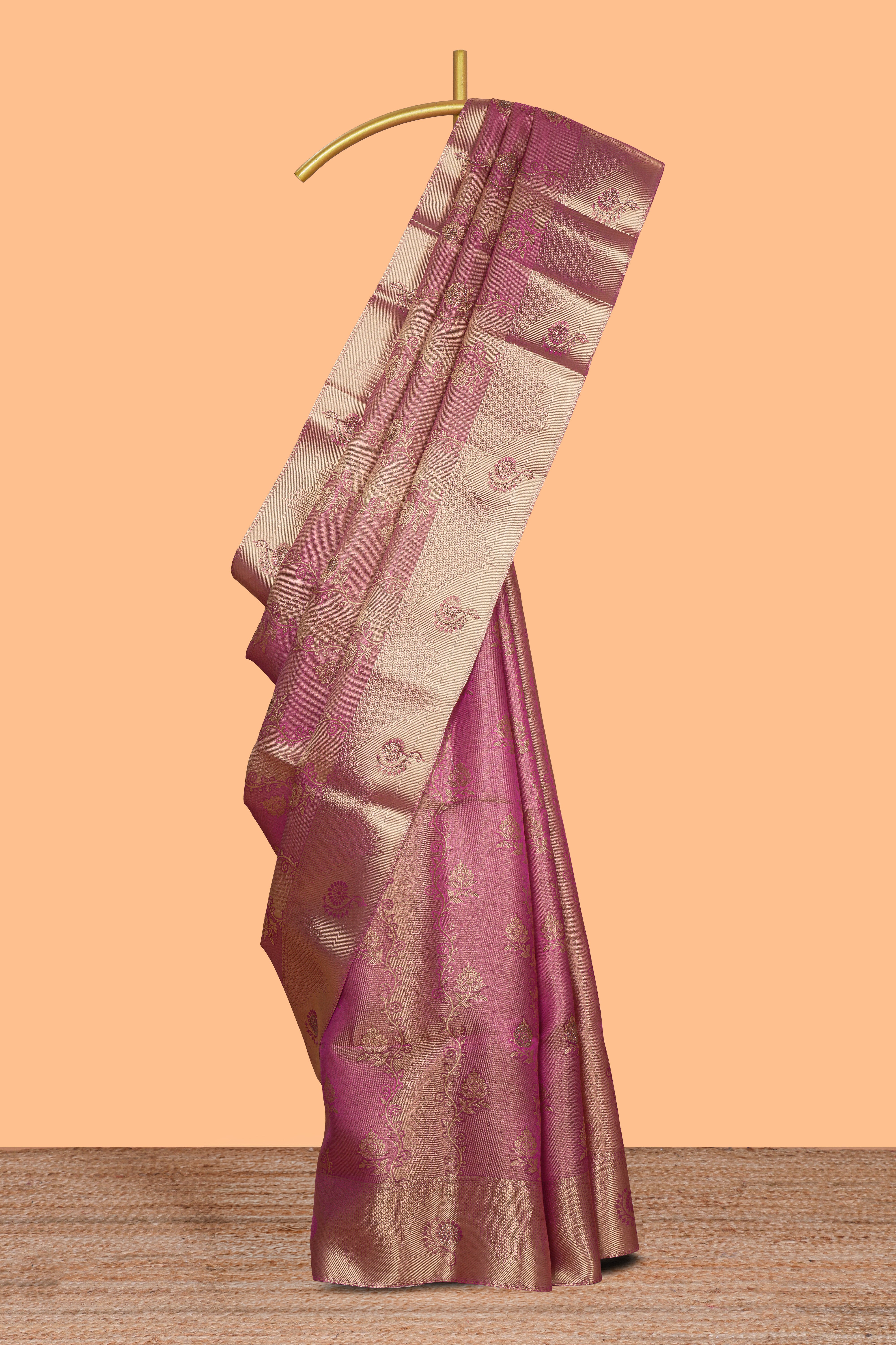 Pink floral vine design art tissue saree with self zari border and contrast blouse