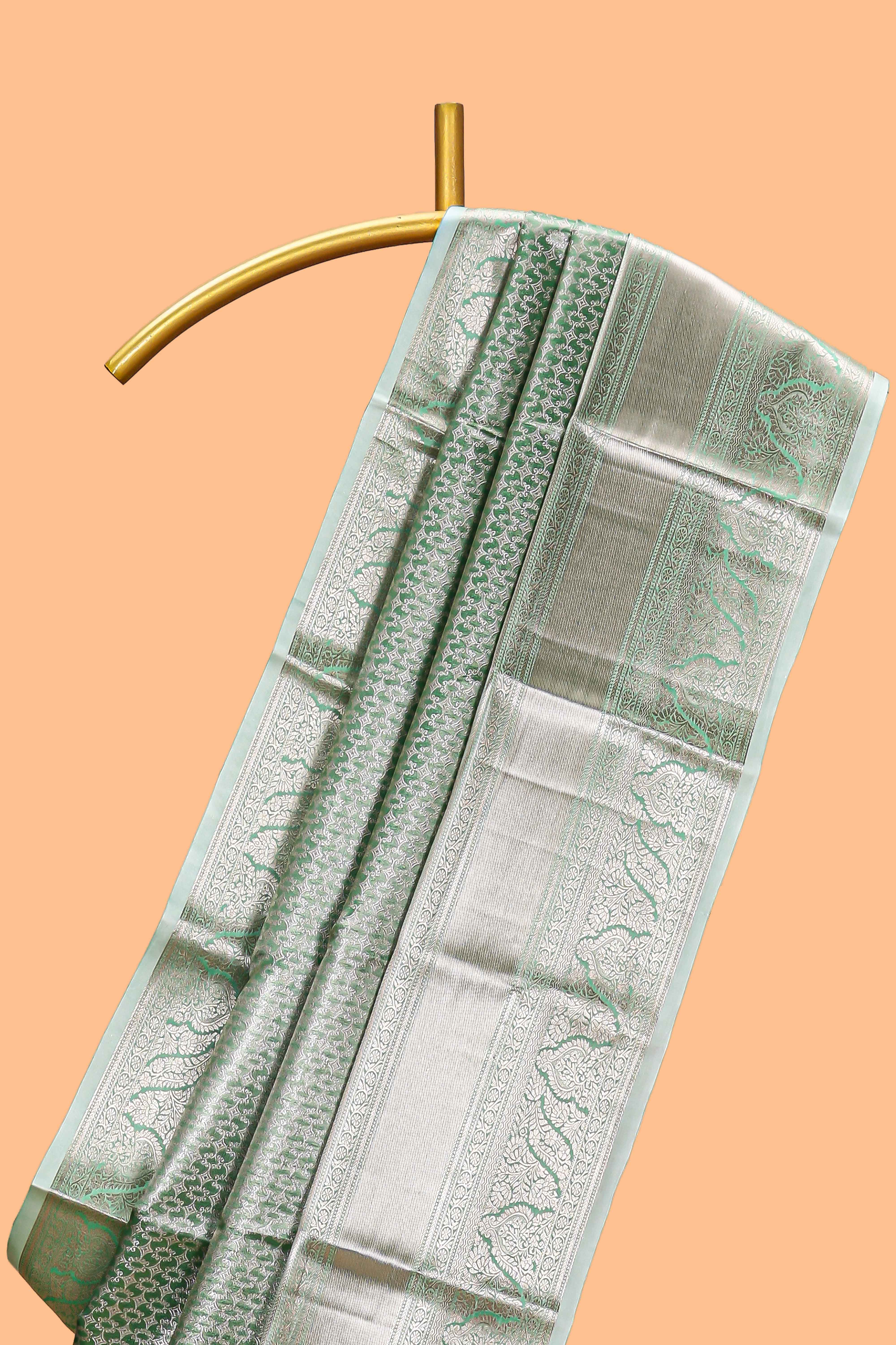 Green silver zari floral design art tissue saree with self zari border and matching blouse