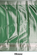Green silver zari floral design art tissue saree with self zari border and matching blouse