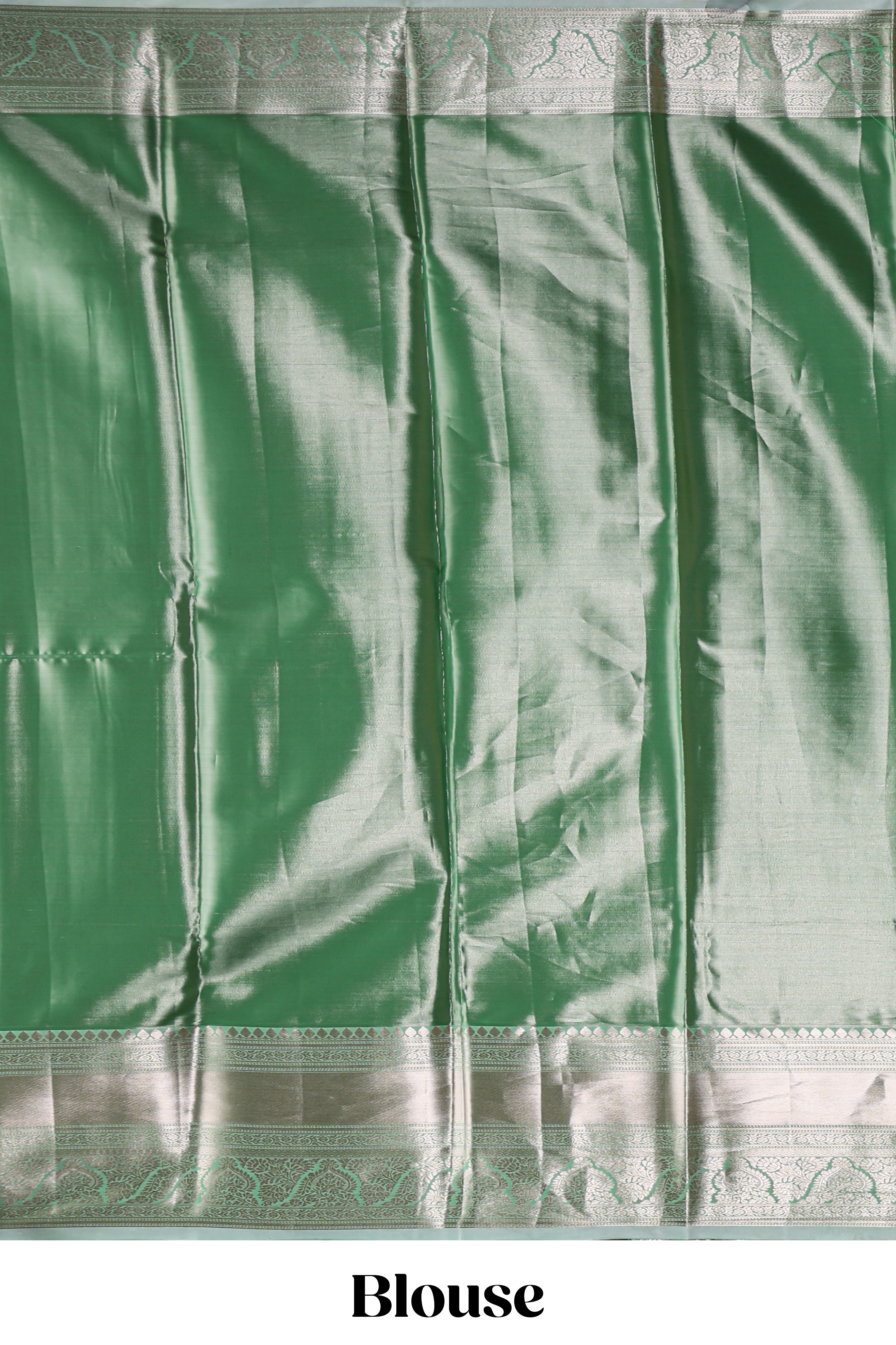Green silver zari floral design art tissue saree with self zari border and matching blouse