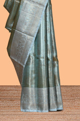 Blue checked zari motifs design art tissue saree with Self zari border and contrast blouse