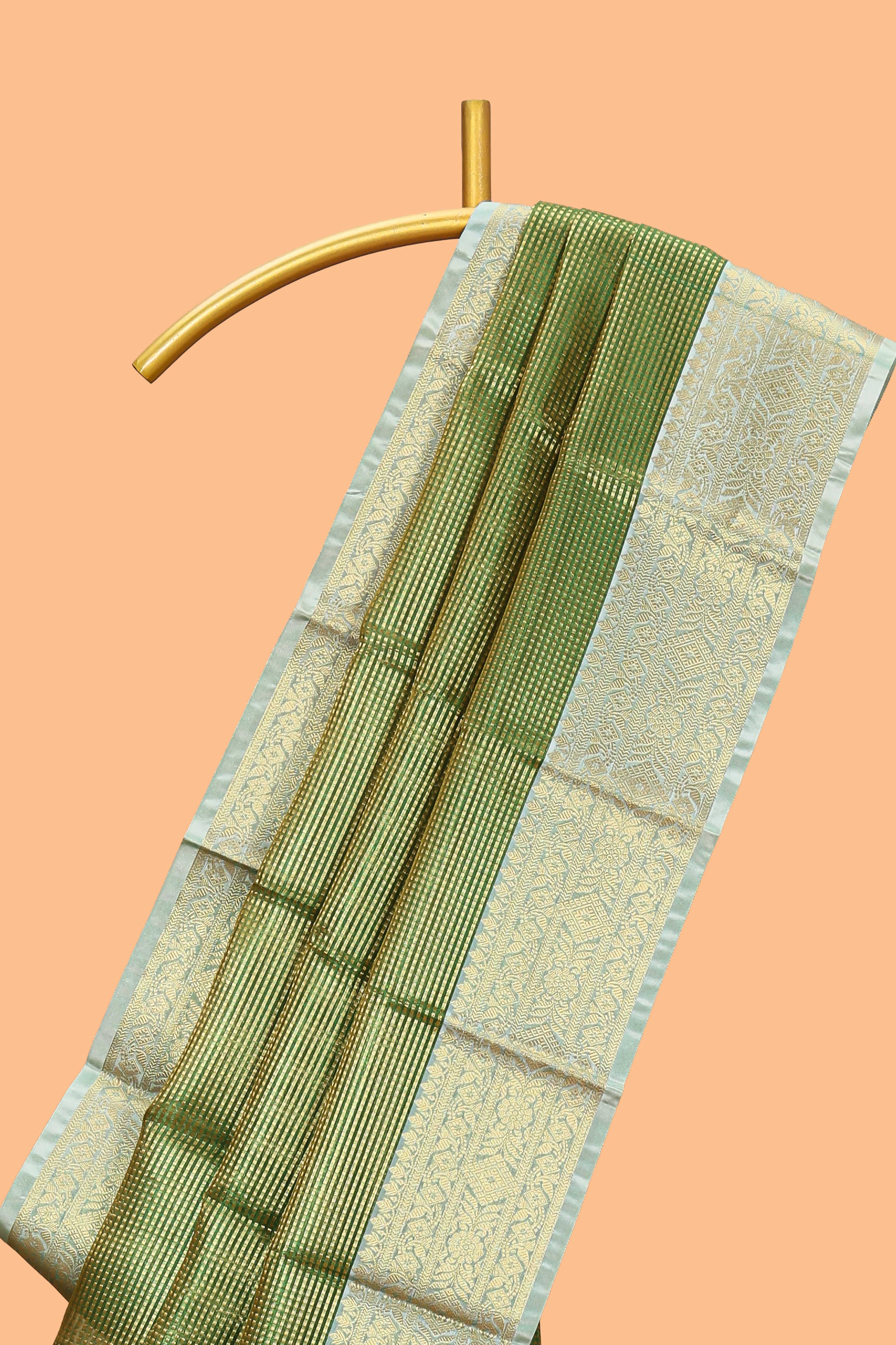 Green zari design art tissue saree with contrast zari border and motifs blouse