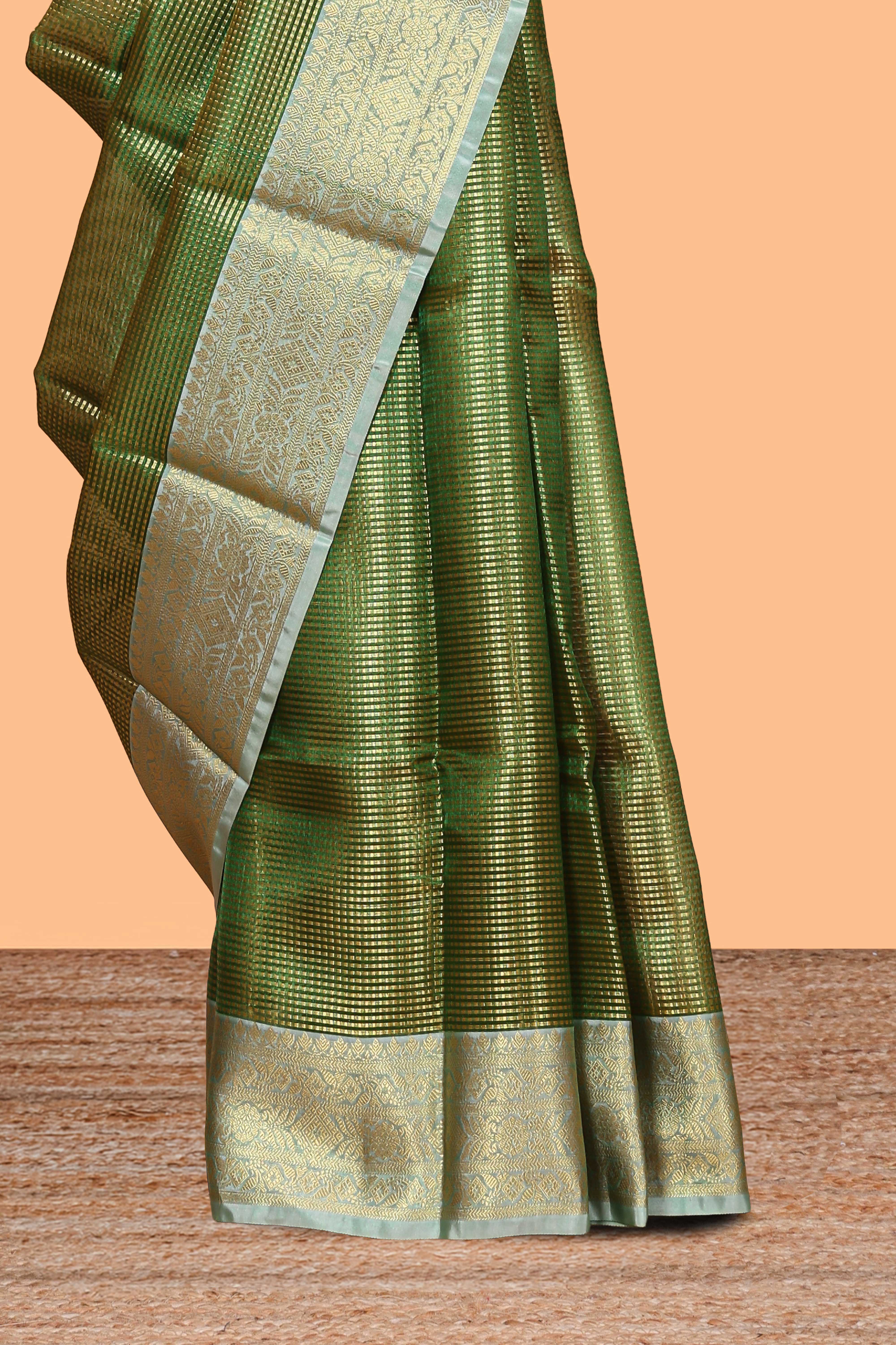 Green zari design art tissue saree with contrast zari border and motifs blouse