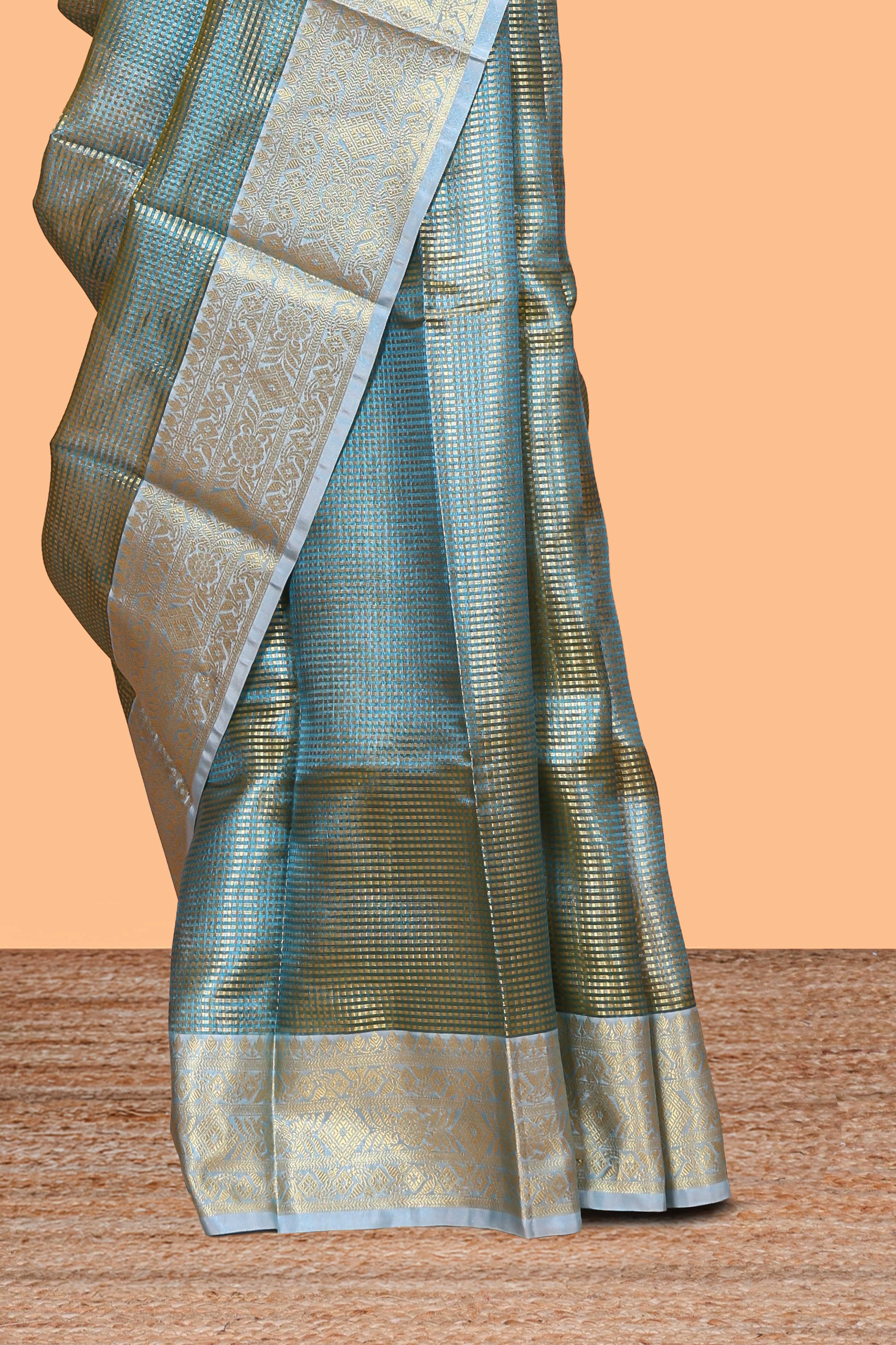 Blue zari design art tissue saree with self zari border and contrast motifs blouse