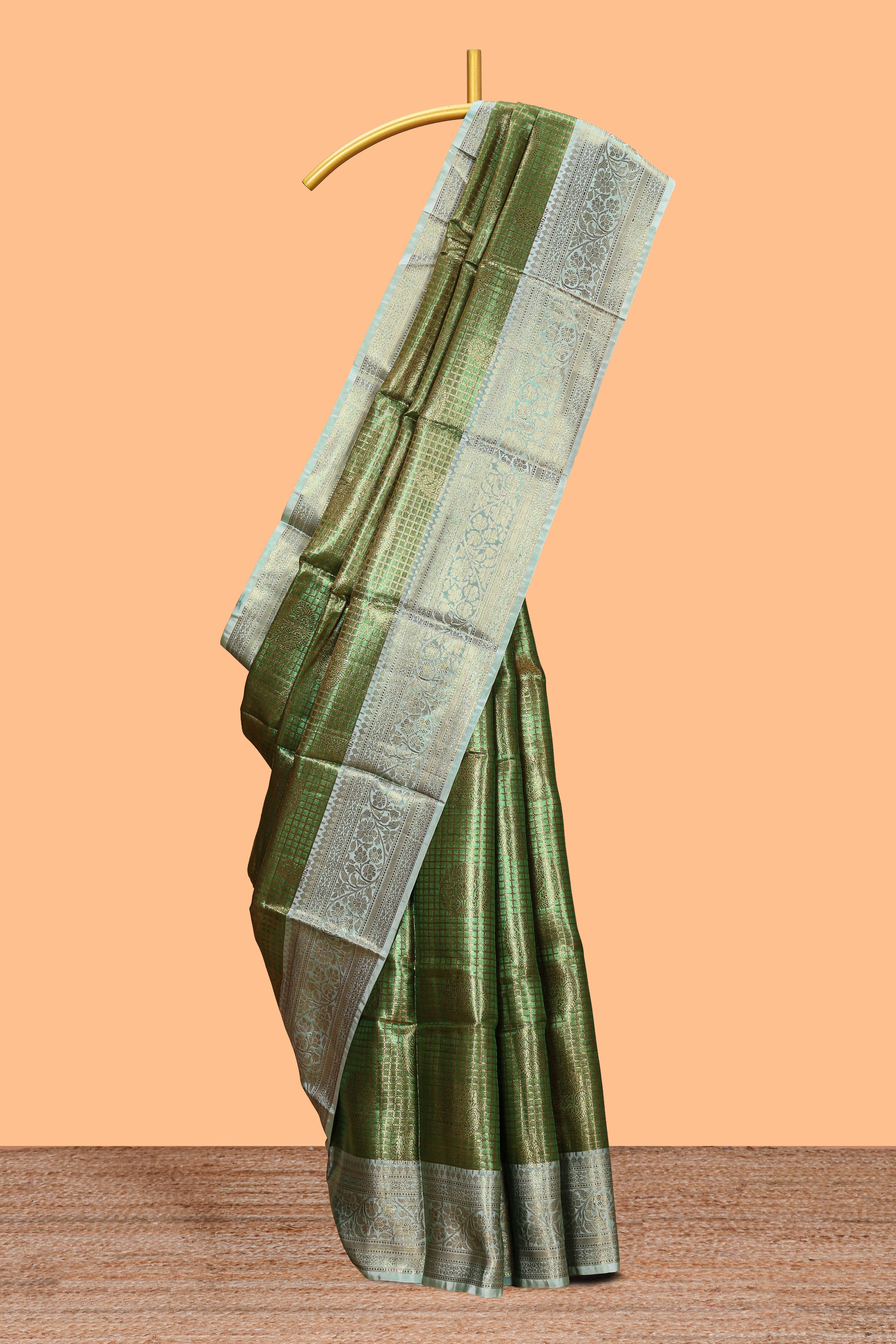 Green checked zari motifs design art tissue saree with self zari border and contrast motifs blouse