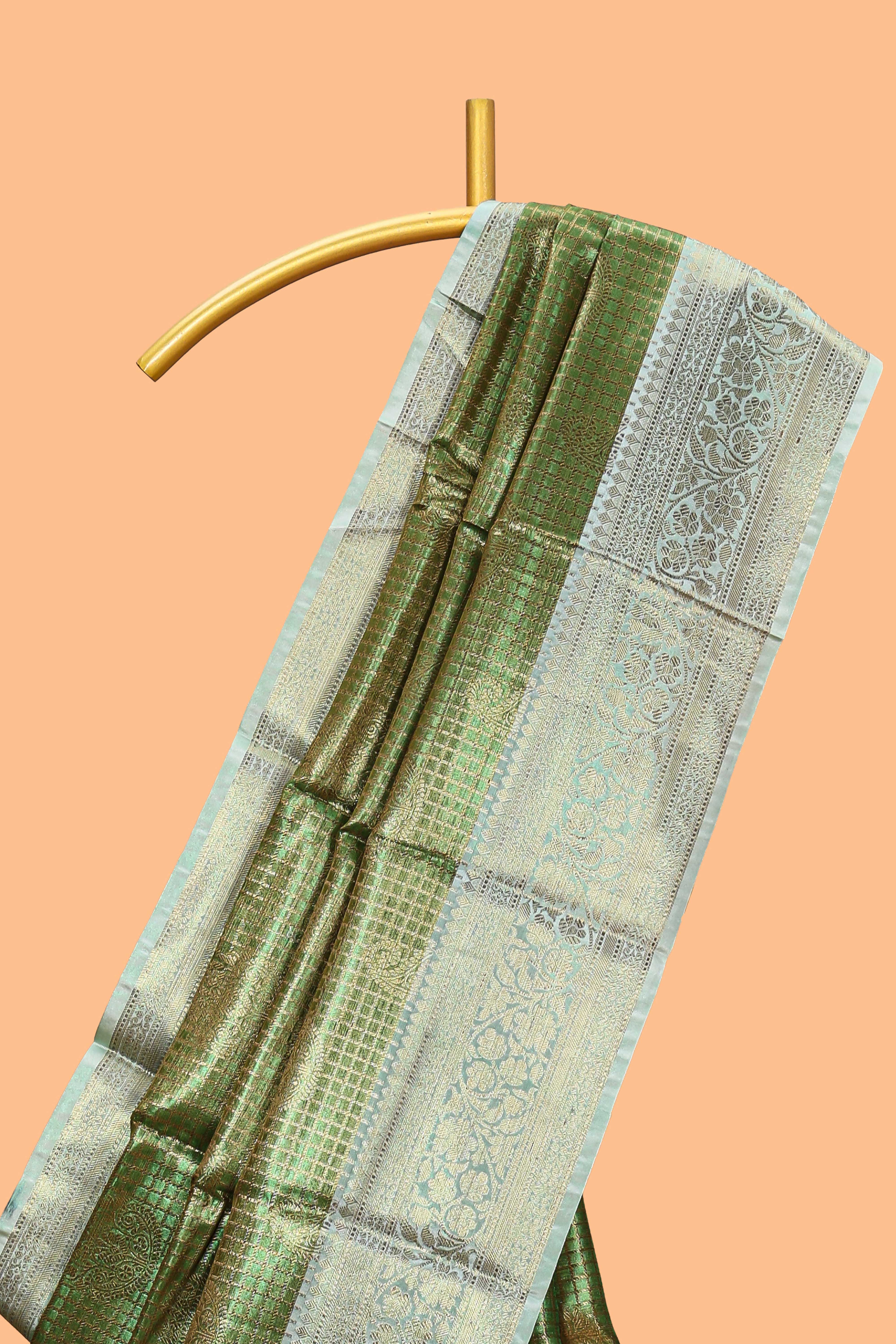 Green checked zari motifs design art tissue saree with self zari border and contrast motifs blouse