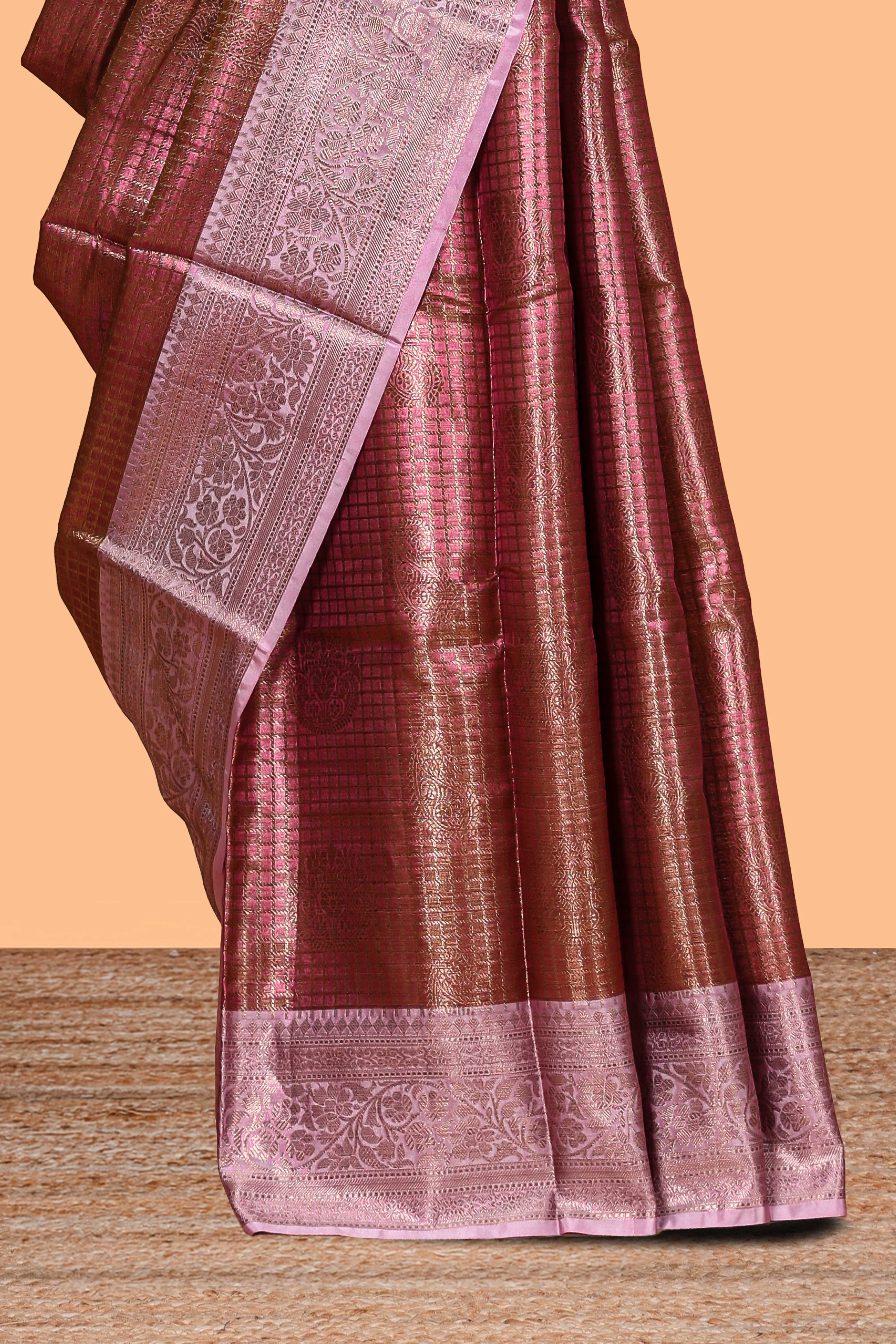 Pink checked zari motifs design art tissue saree with self zari border and contrast motifs blouse