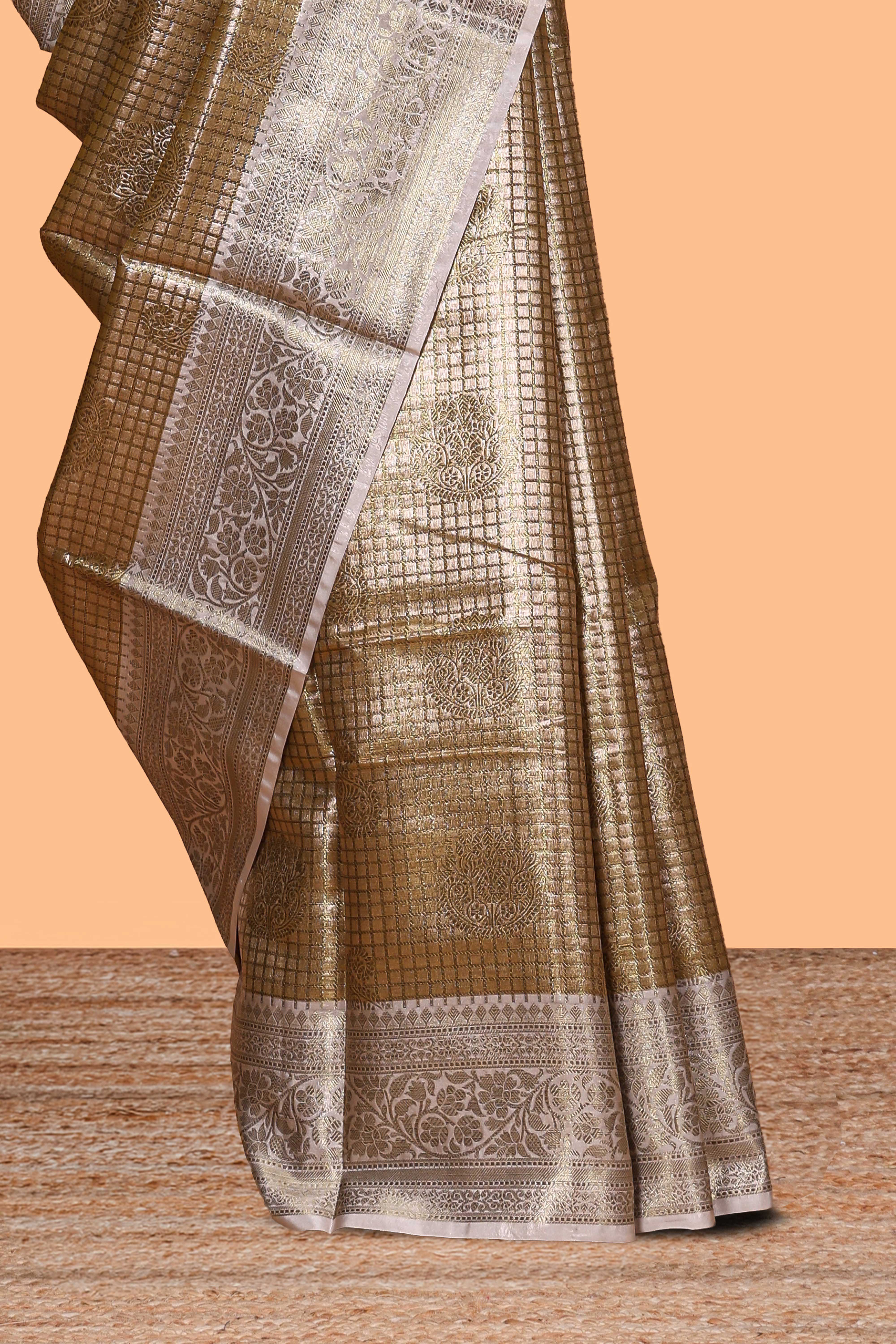 Golden beige checked zari motifs design art tissue saree with contrast zari border and matching printed blouse