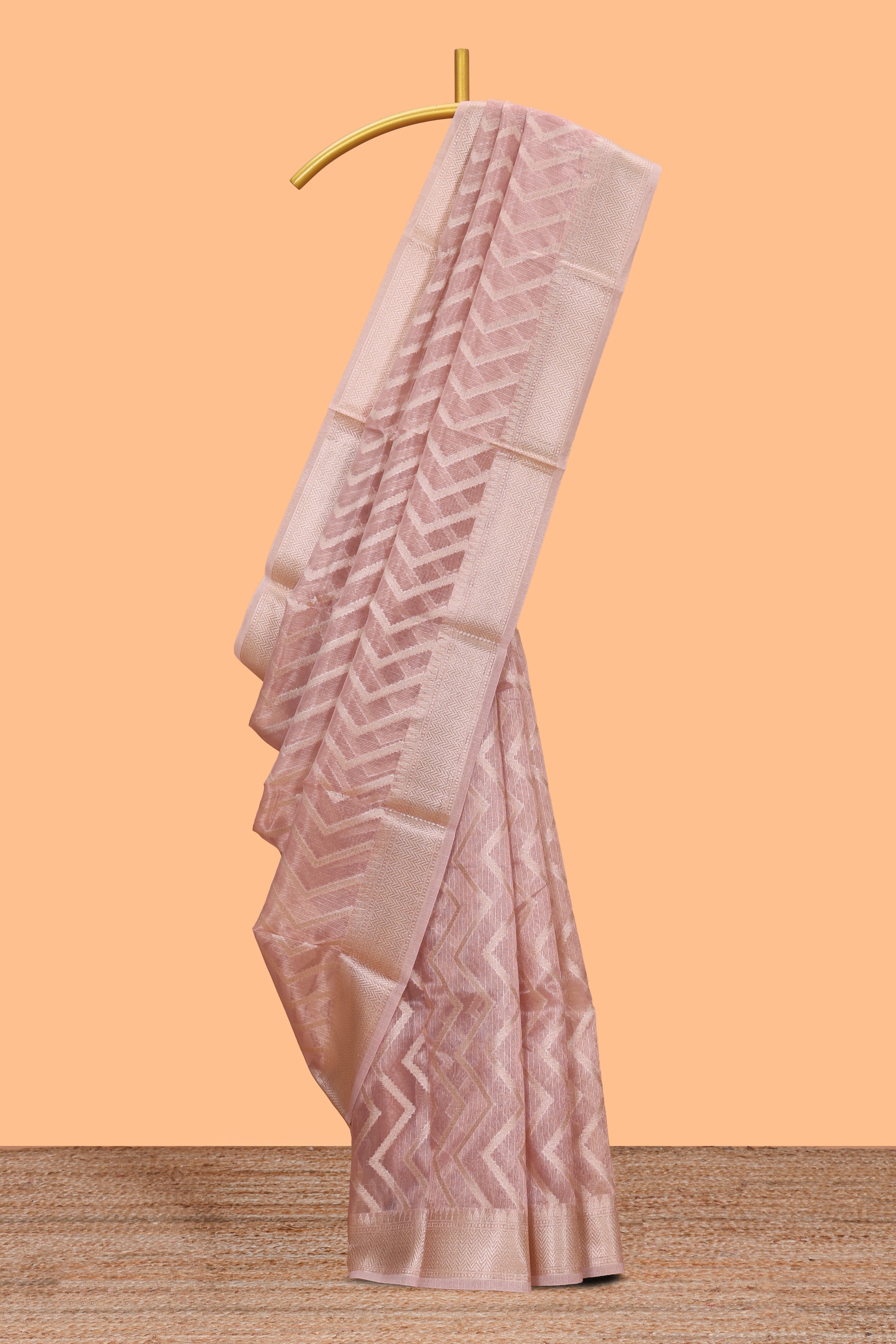 Peach chevron design art tissue saree with self zari border and matching printed blouse