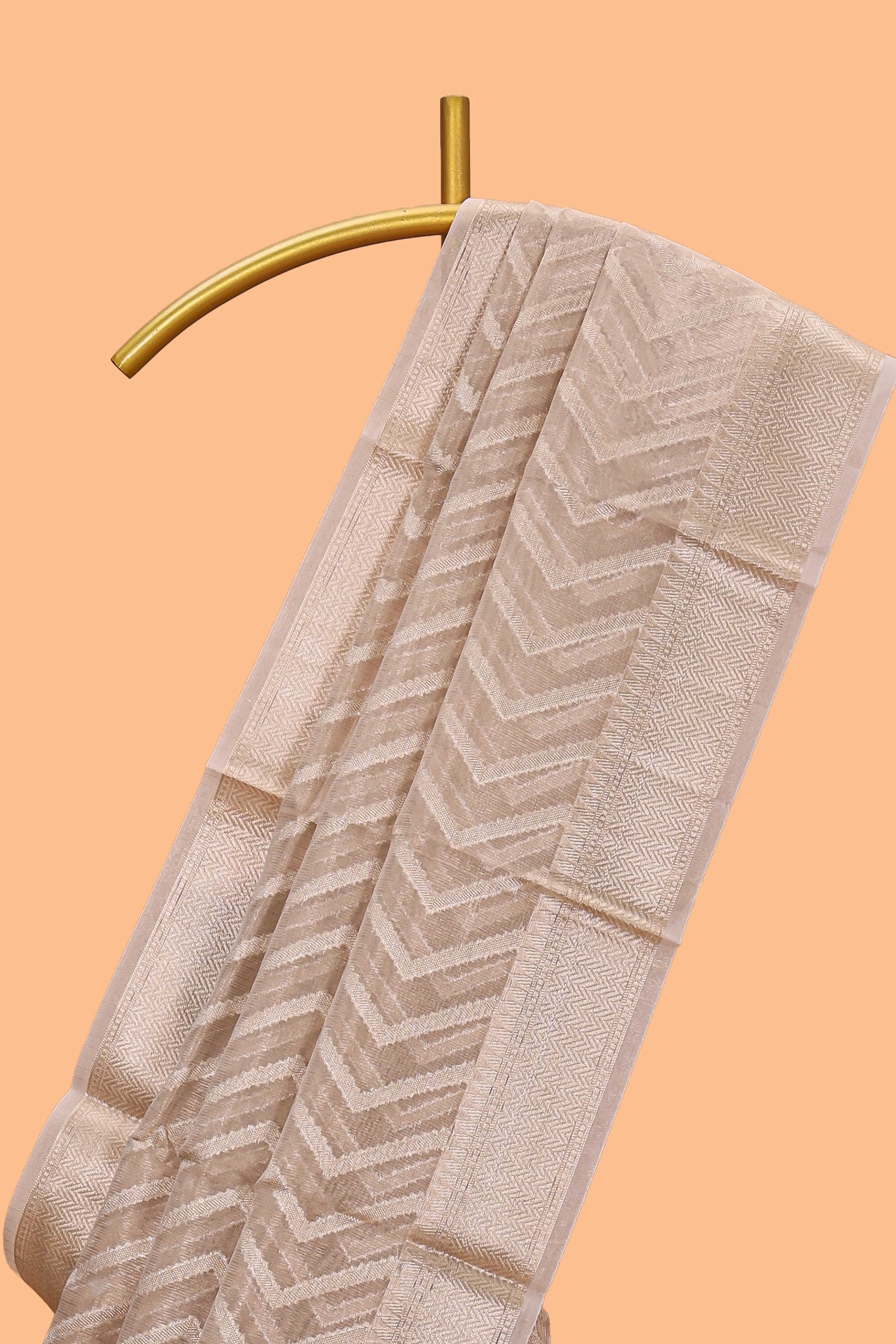 Beige chevron design art tissue saree with self zari border and matching printed blouse