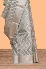 Grey chevron design art tissue saree with self zari border and matching printed blouse