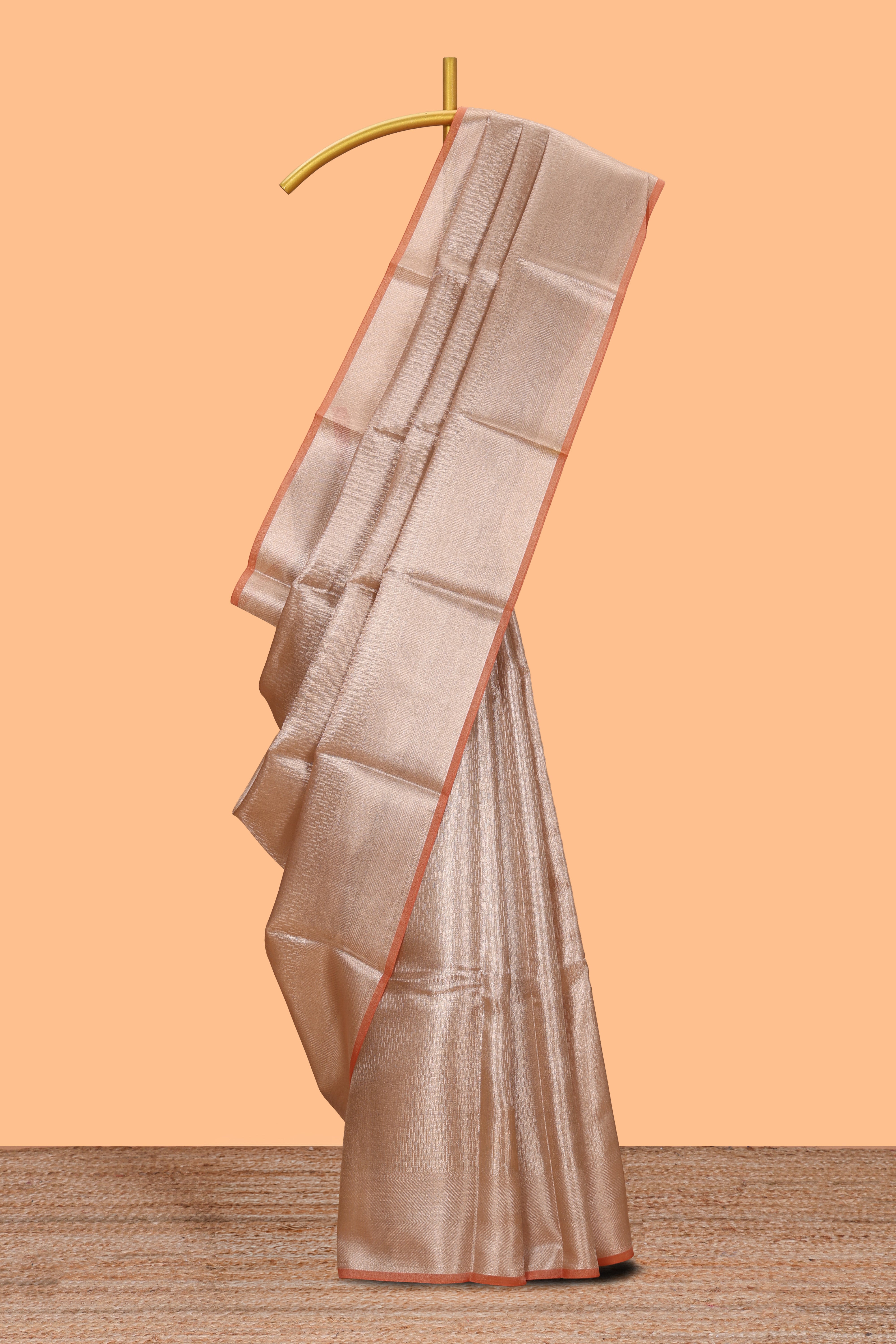 Beige geometric zari design art tissue saree with self zari border and matching blouse