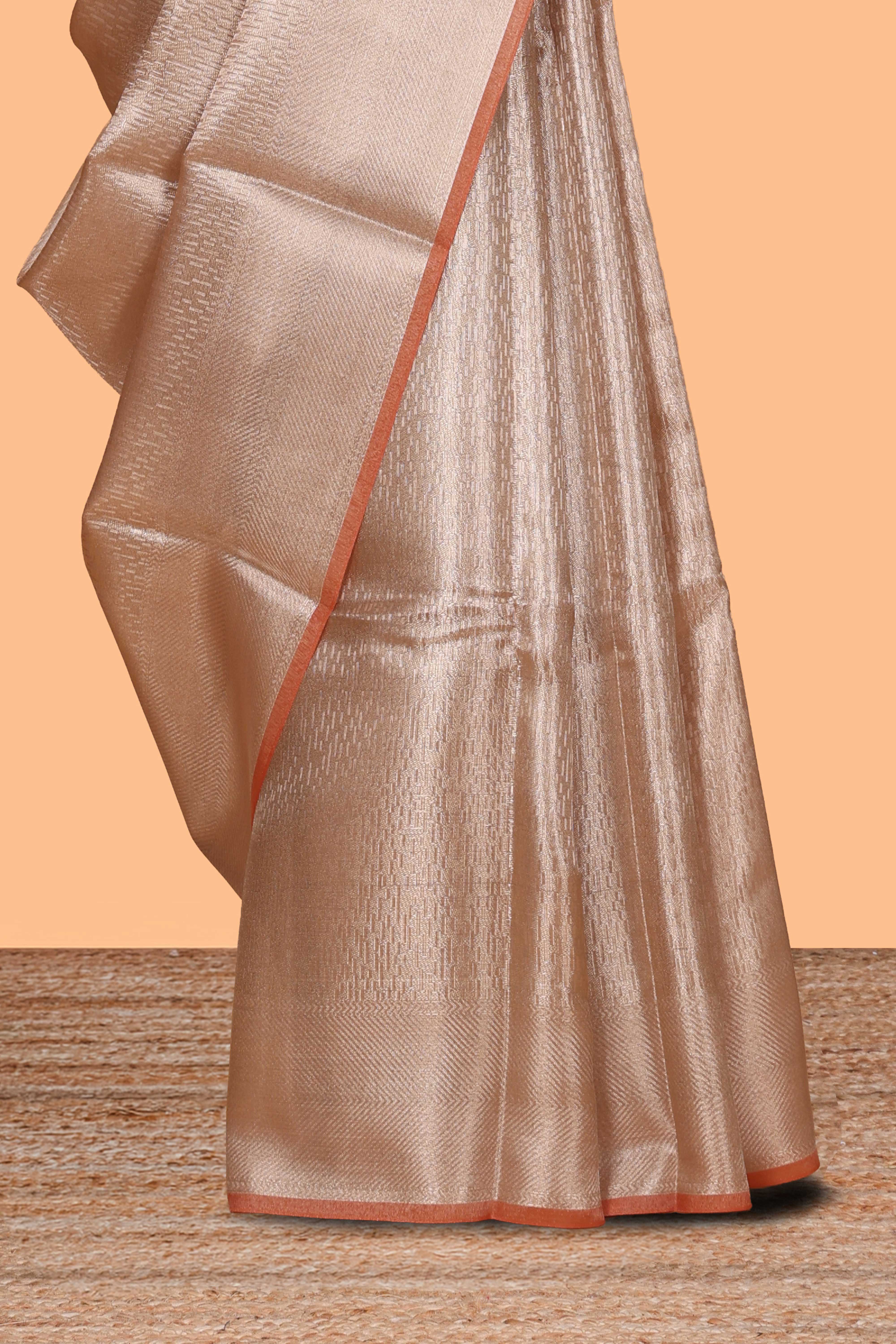 Beige geometric zari design art tissue saree with self zari border and matching blouse