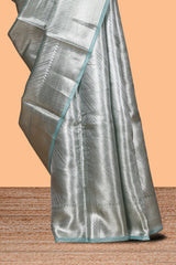 Pastel green vertical striped design art tissue saree with self zari border and matching blouse
