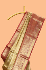 Mustard yellow geometric design art tissue saree with contrast zari border and blouse