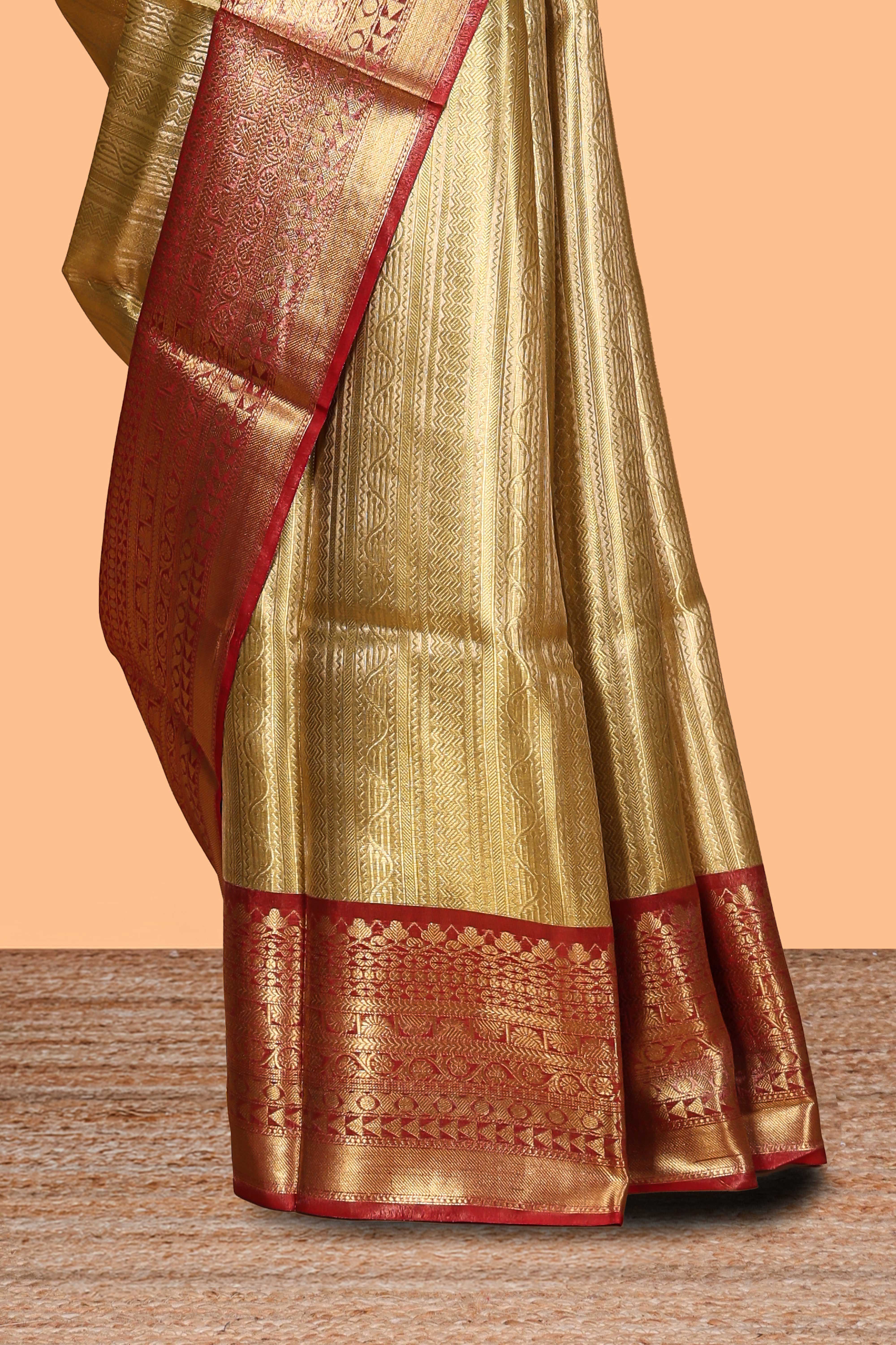 Mustard yellow geometric design art tissue saree with contrast zari border and blouse