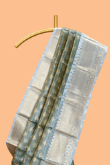 Blue unique design zari motifs art tissue saree with contrast border and blouse