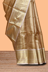 Gold small zari checks design art tissue saree with contrast border and blouse