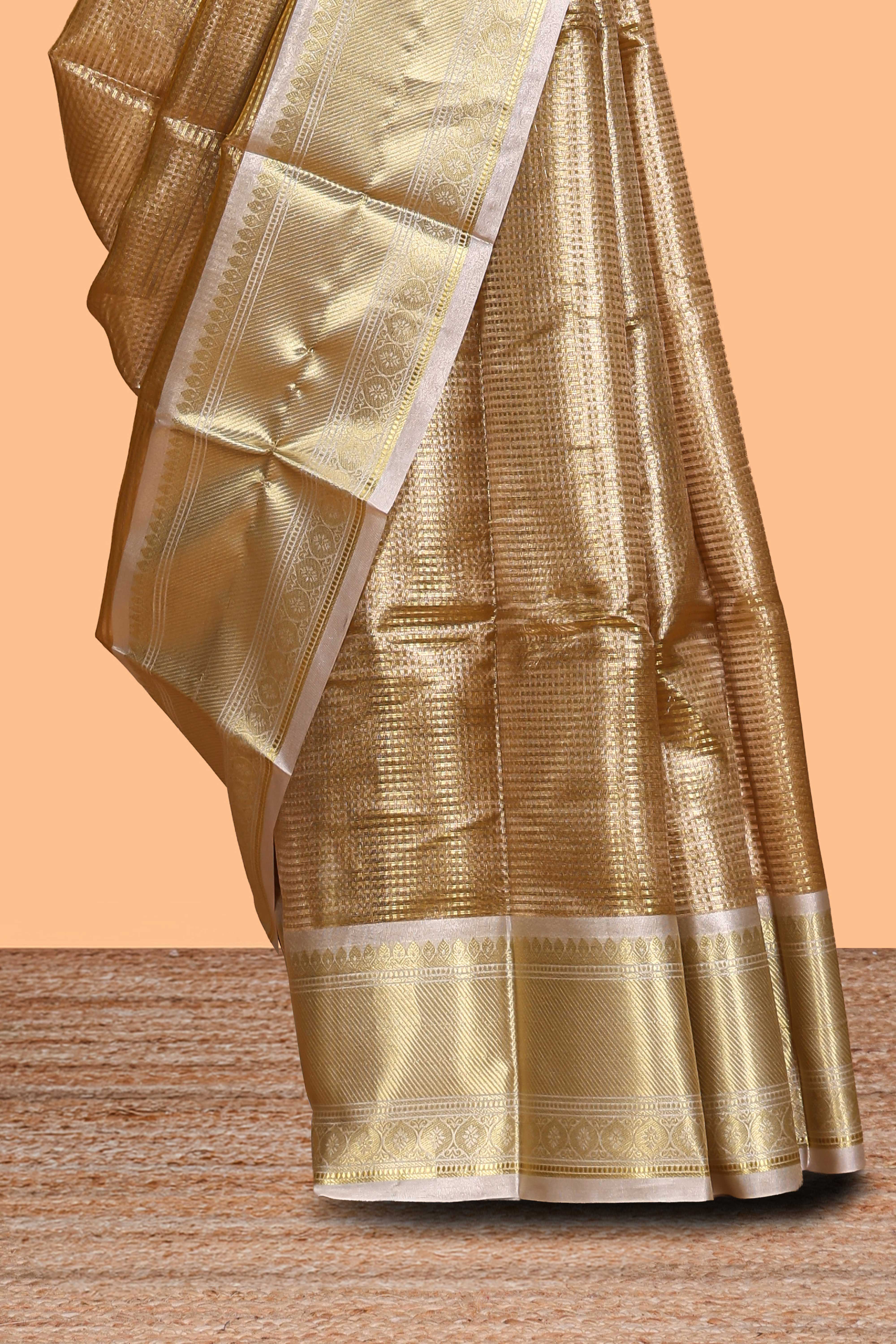 Gold small zari checks design art tissue saree with contrast border and blouse