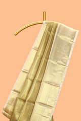 Pale gold small zari checks design art tissue saree with self border and blouse