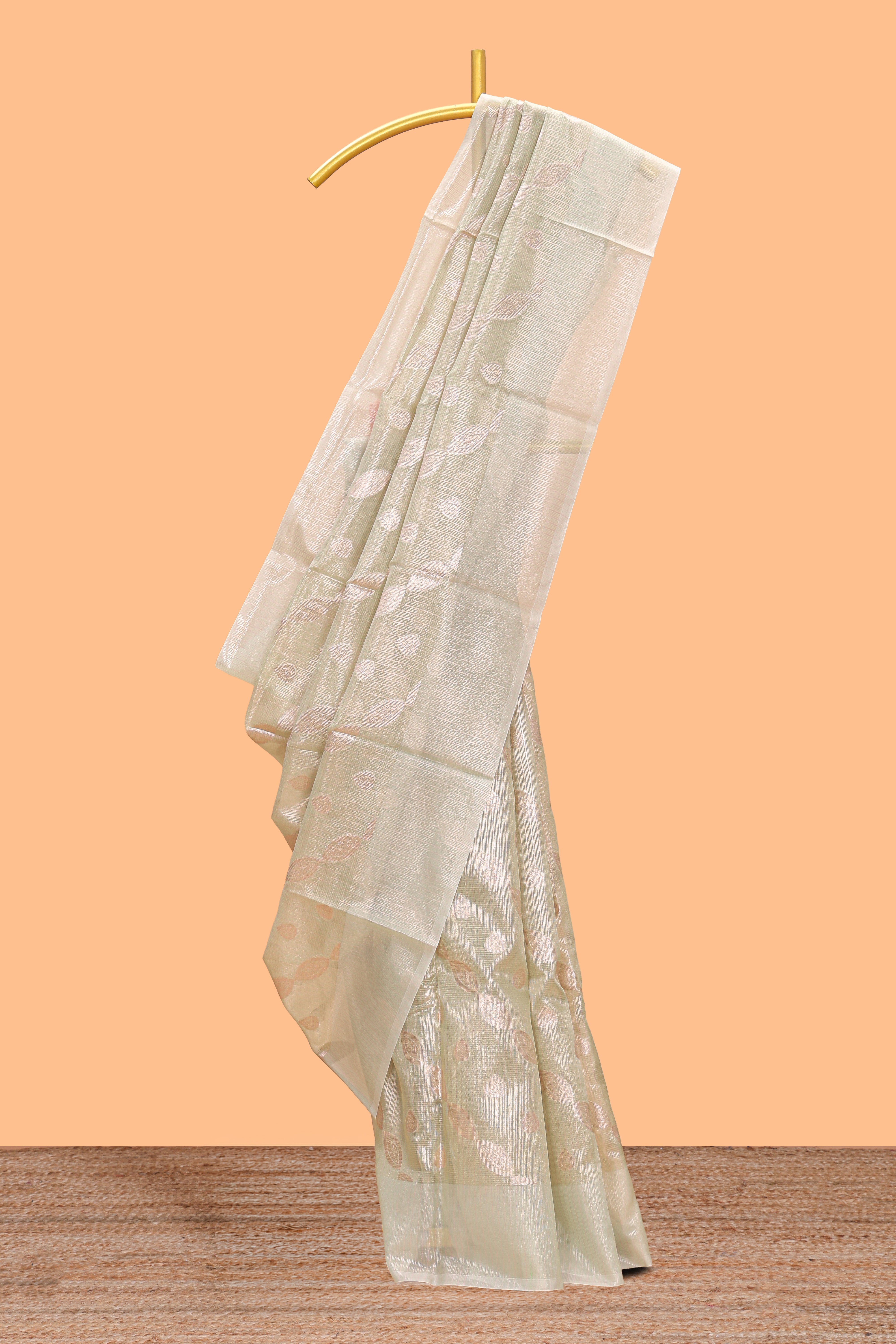 Mint green scattered floral and leaf motifs art tissue saree with self pallu and plain border