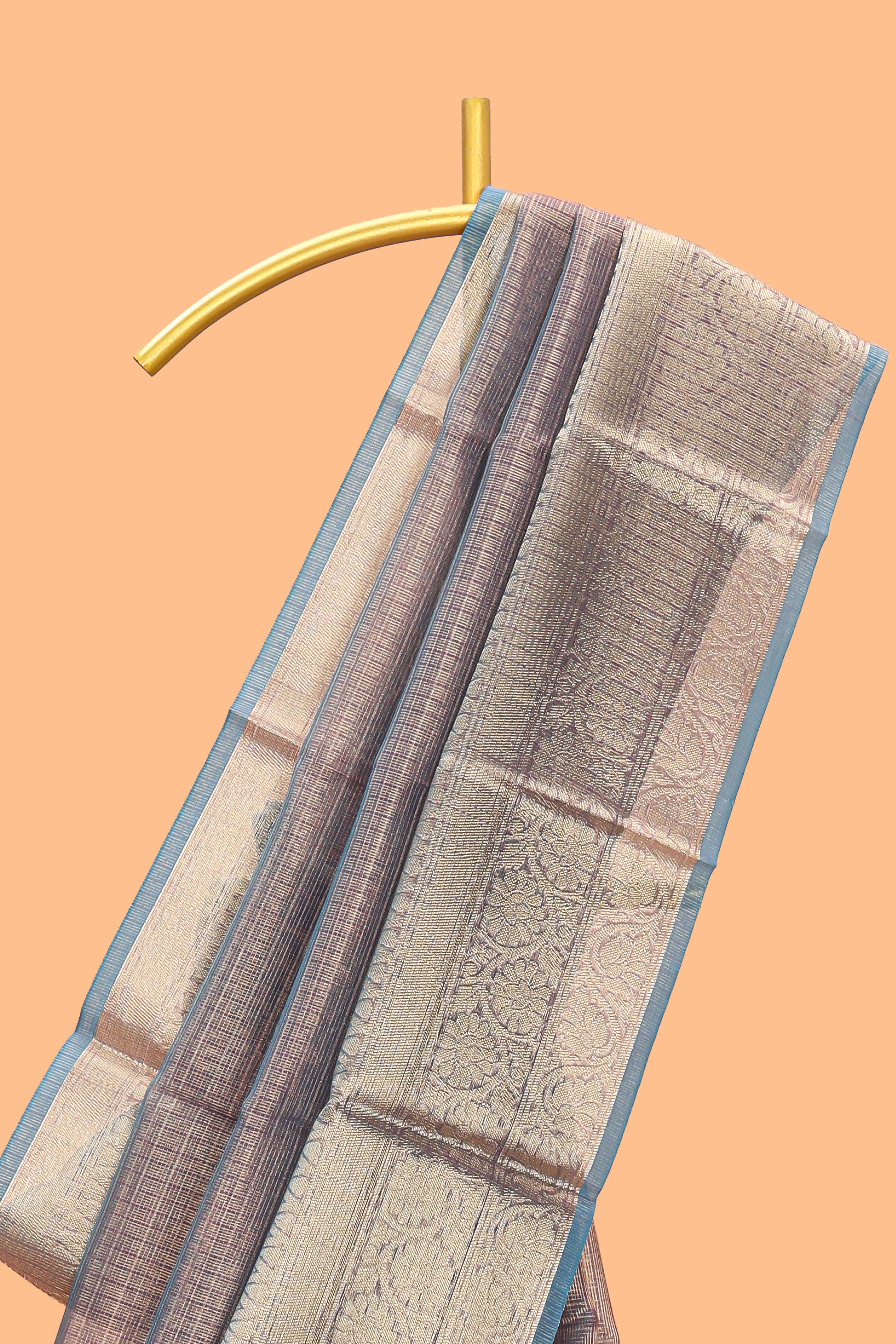 Mauve shade art tissue saree with antique gold zari border and contrast blouse