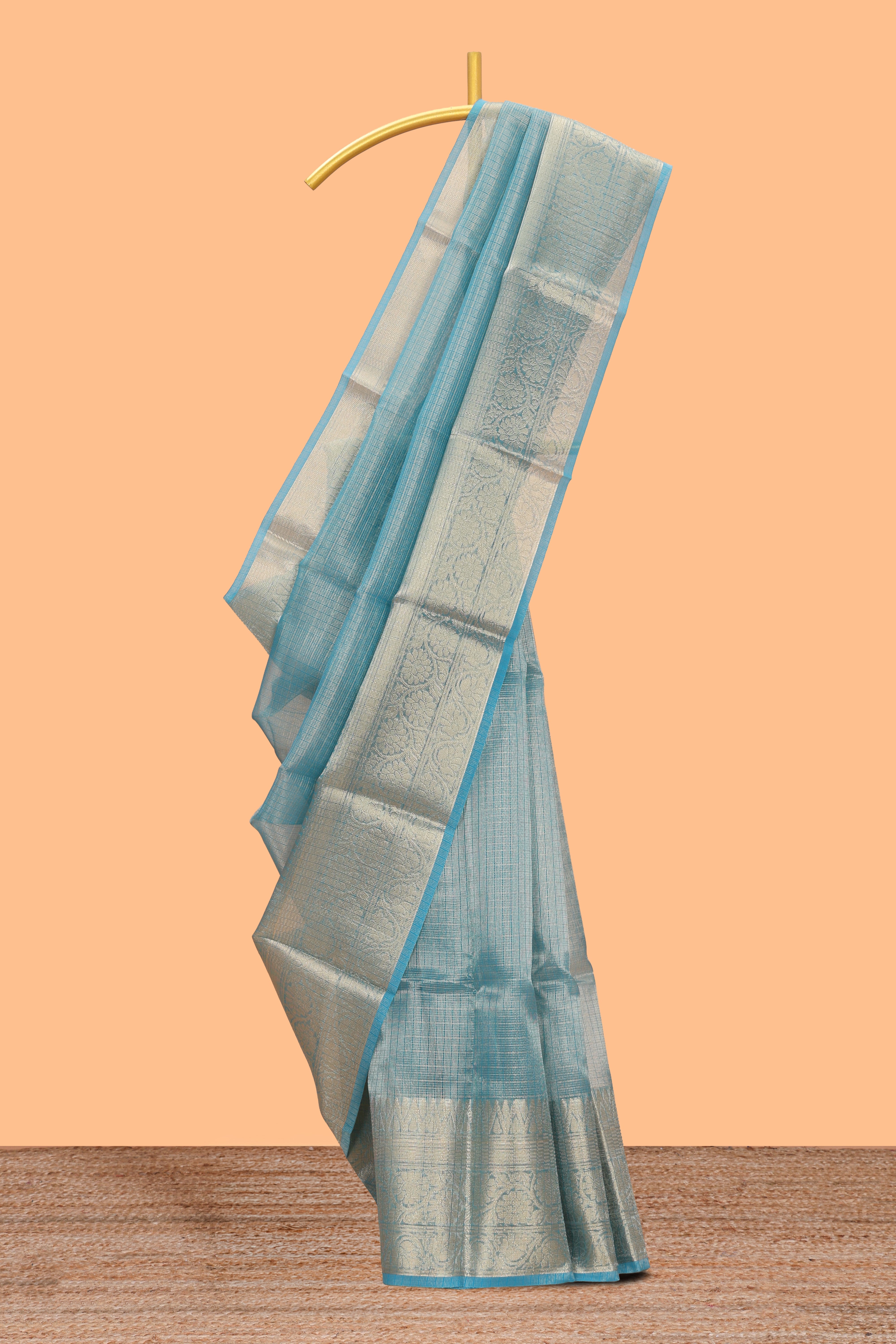 Teal blue Checked art tissue saree with floral zari border and contrast blouse