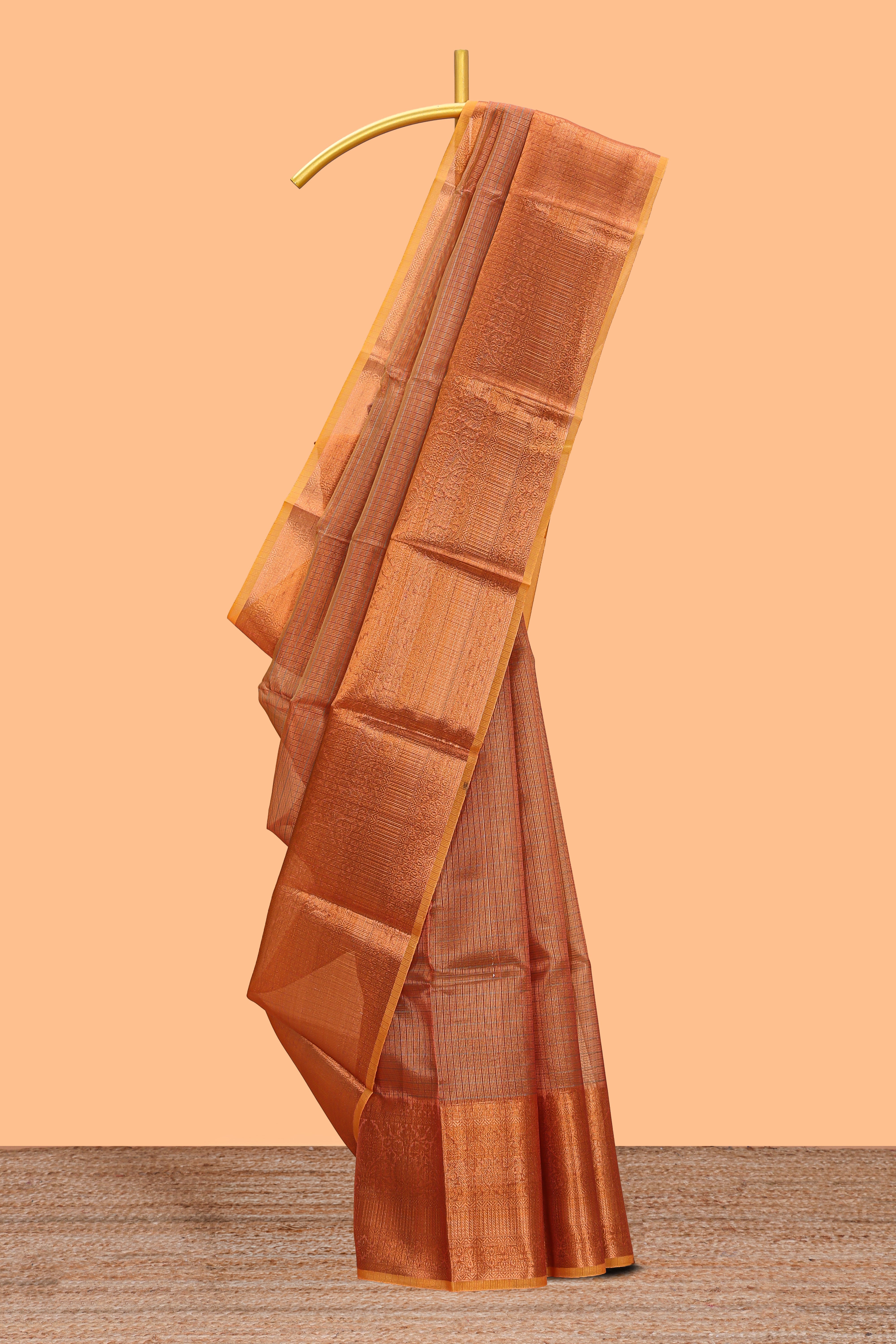 Rust orange checked art tissue saree with contrast zari border and matching blouse