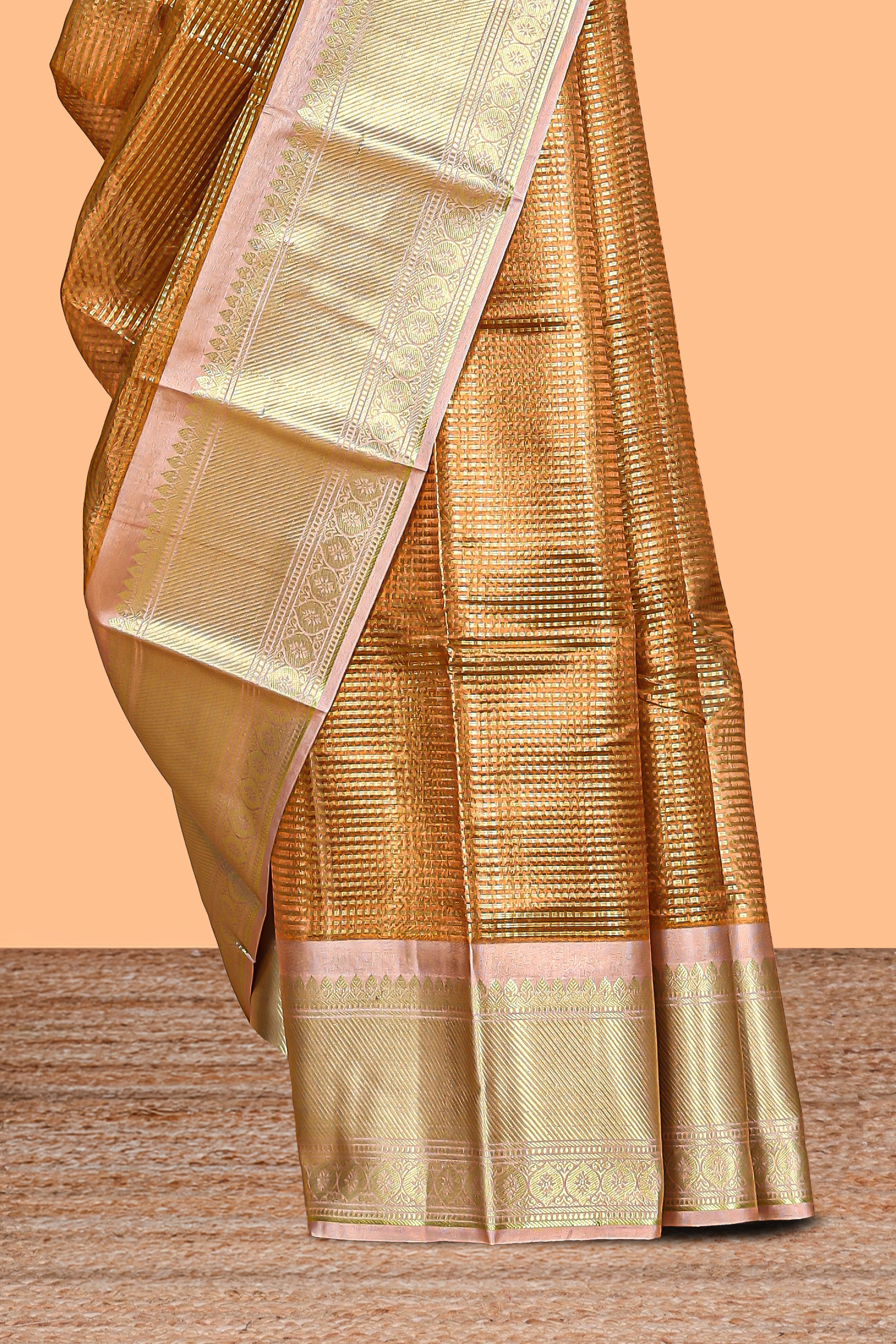 Bronze striped art tissue saree with contrast zari border and blouse