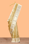 Gold zari motifs art tissue saree with contrast zari border and blouse