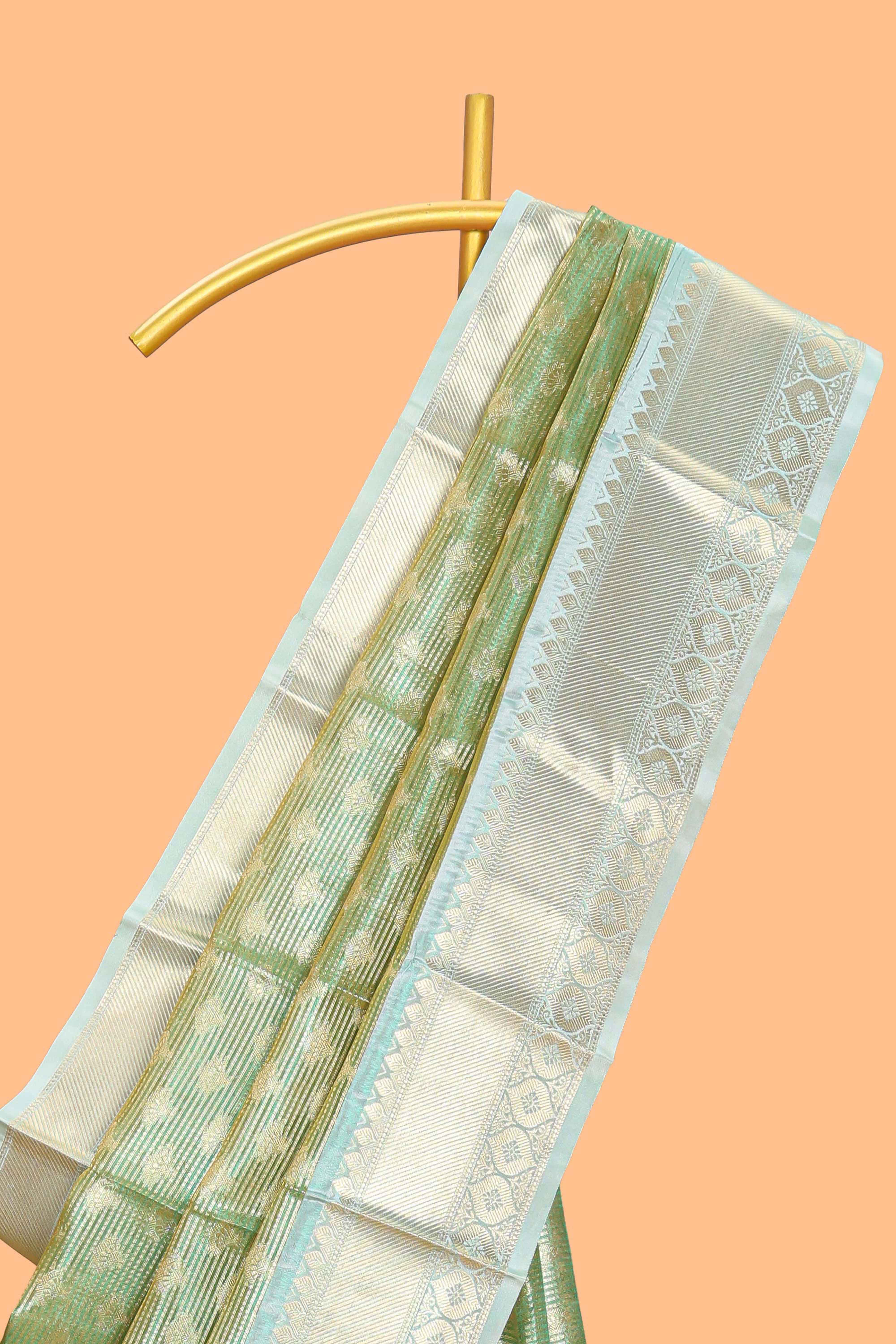 Green zari motifs design art tissue saree with contrast zari border and motifs blouse