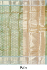 Green zari motifs design art tissue saree with contrast zari border and motifs blouse