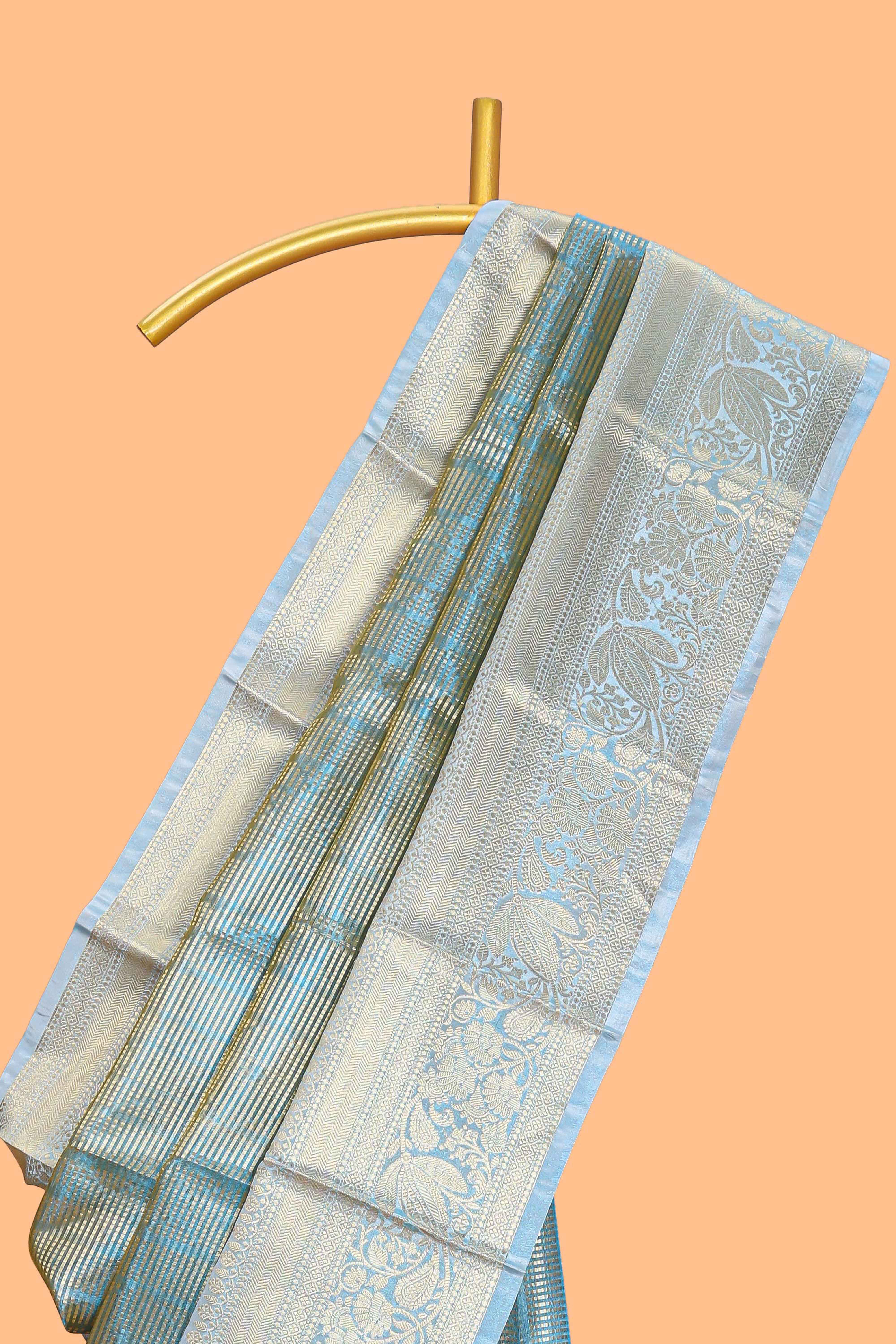 Blue zari design art tissue saree with self zari border and contrast blouse