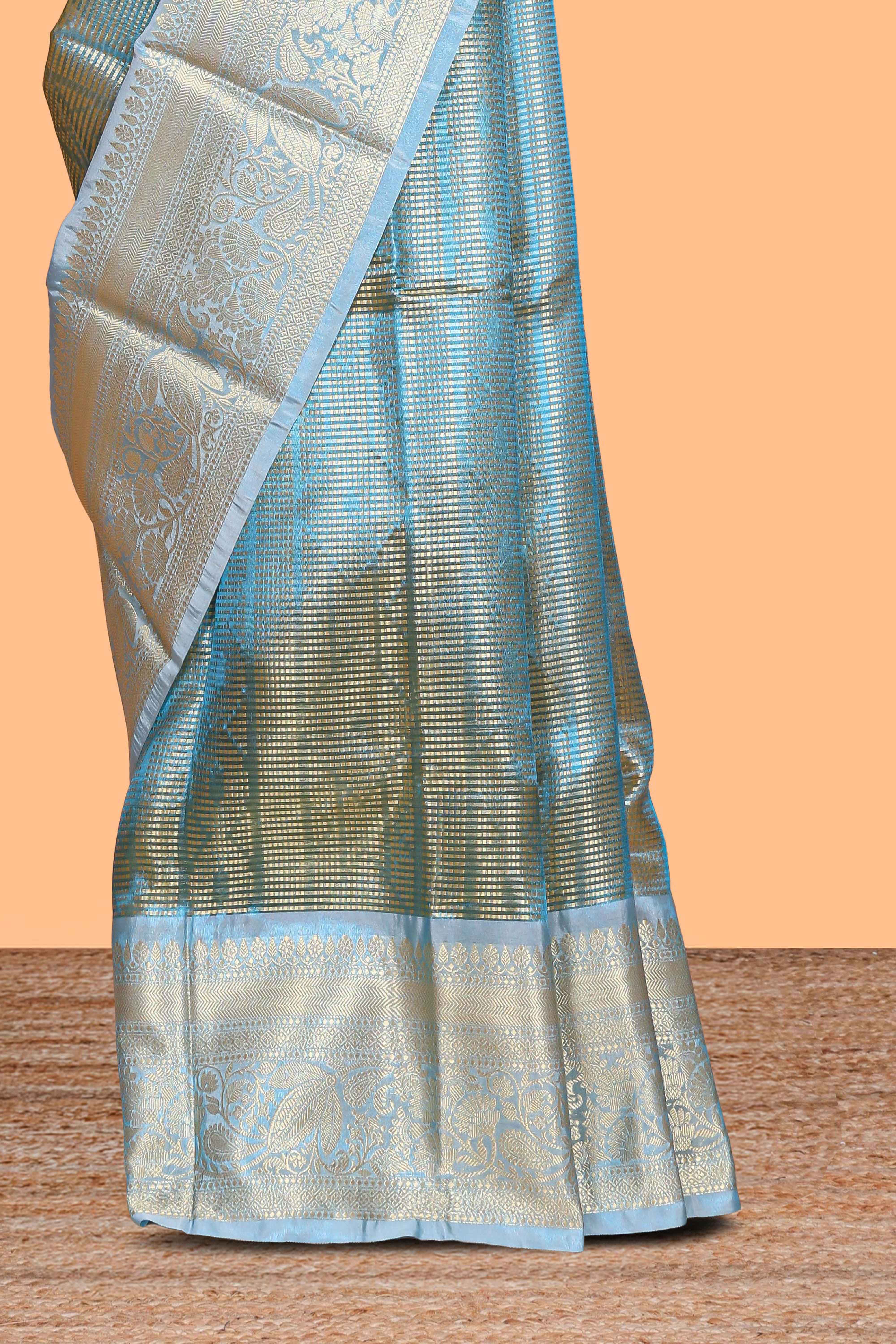 Blue zari design art tissue saree with self zari border and contrast blouse