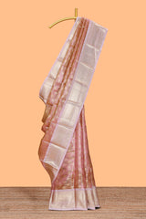 Rust orange zari design art tissue saree with contrast zari border and motifs blouse