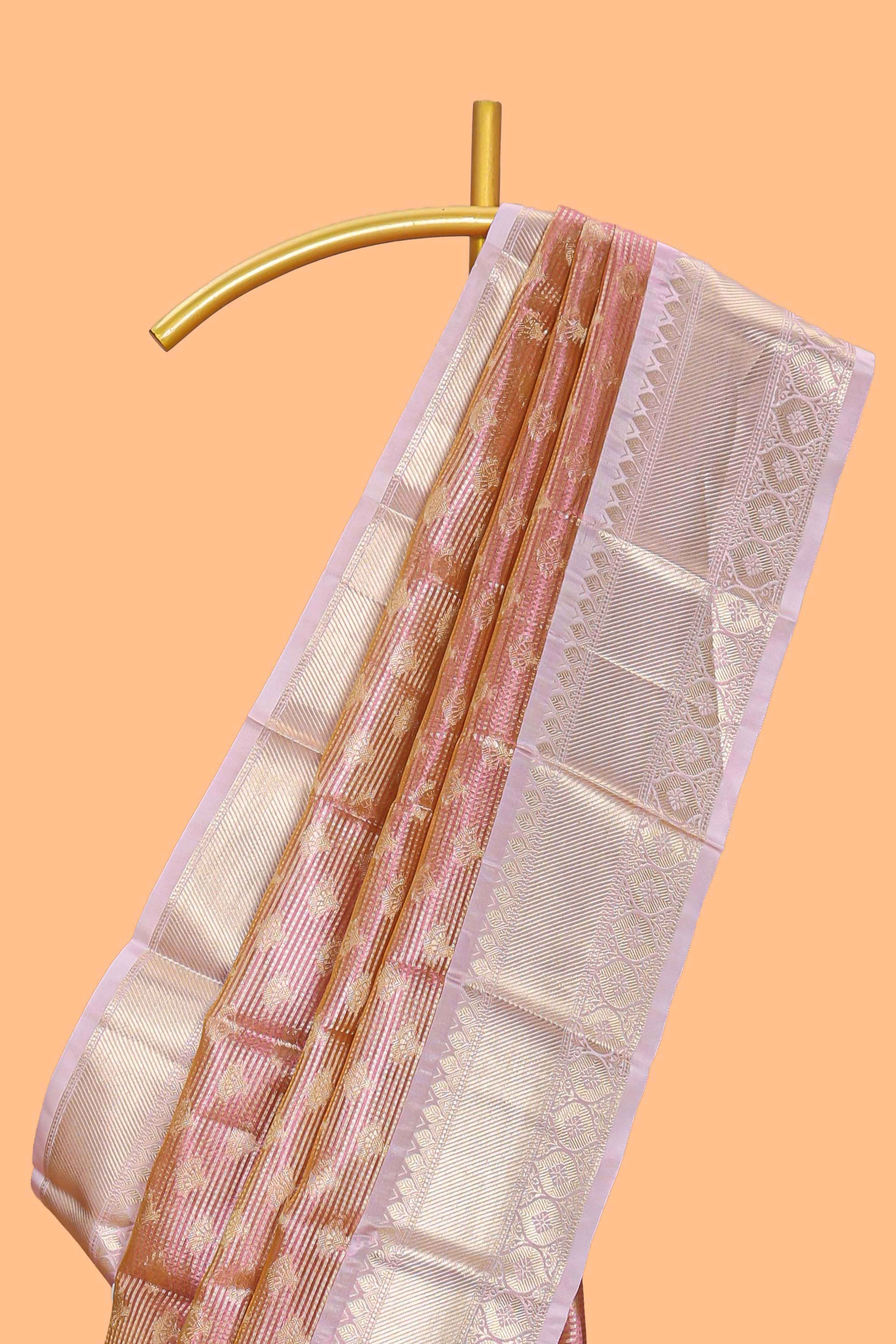 Rust orange zari design art tissue saree with contrast zari border and motifs blouse