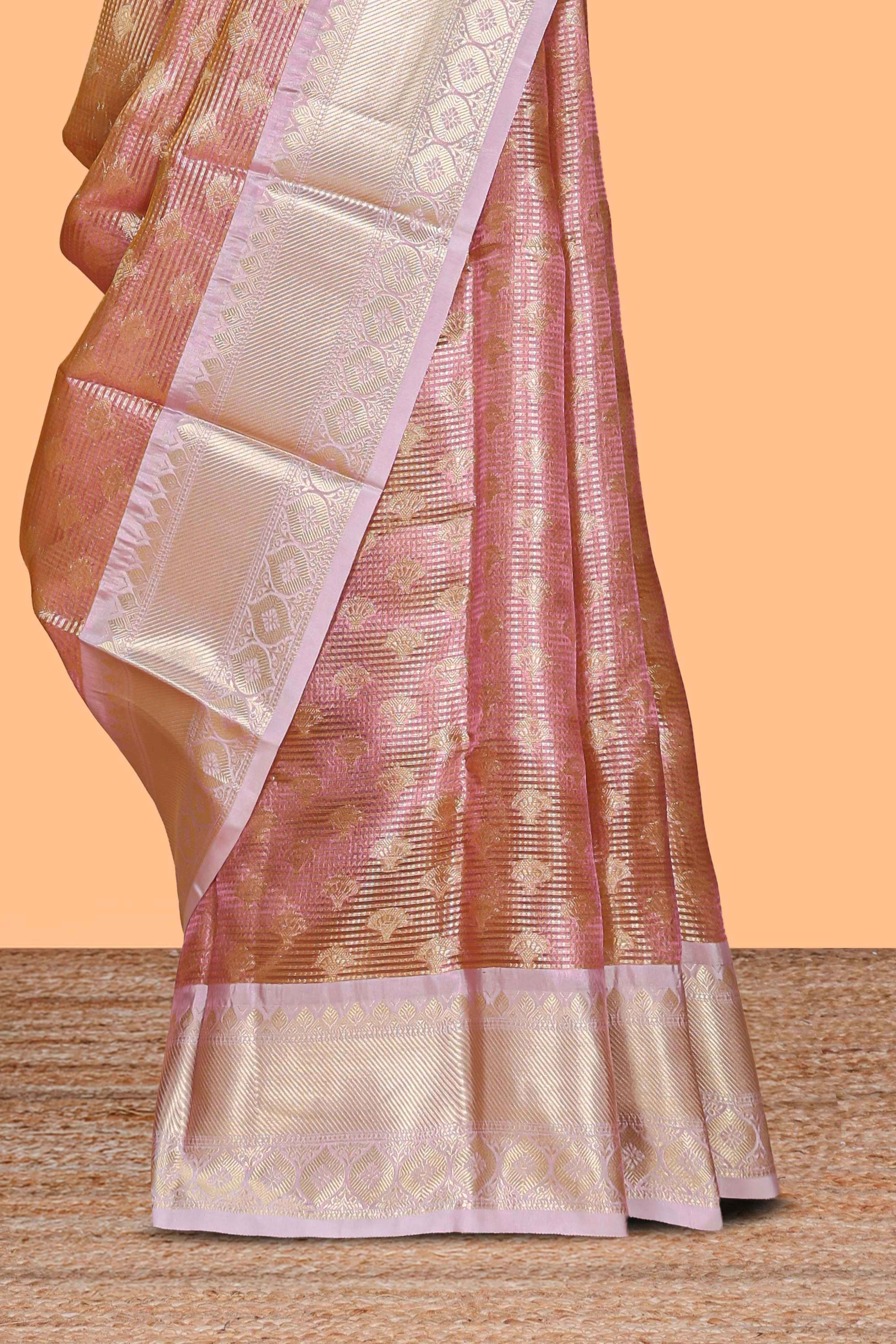 Rust orange zari design art tissue saree with contrast zari border and motifs blouse