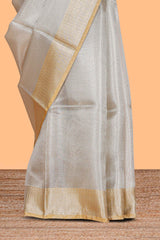 Grey zari design art tissue saree with contrast border and zari design blouse