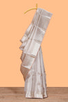 Beige slive shade geometric zari design art tissue saree with self zari border and matching blouse